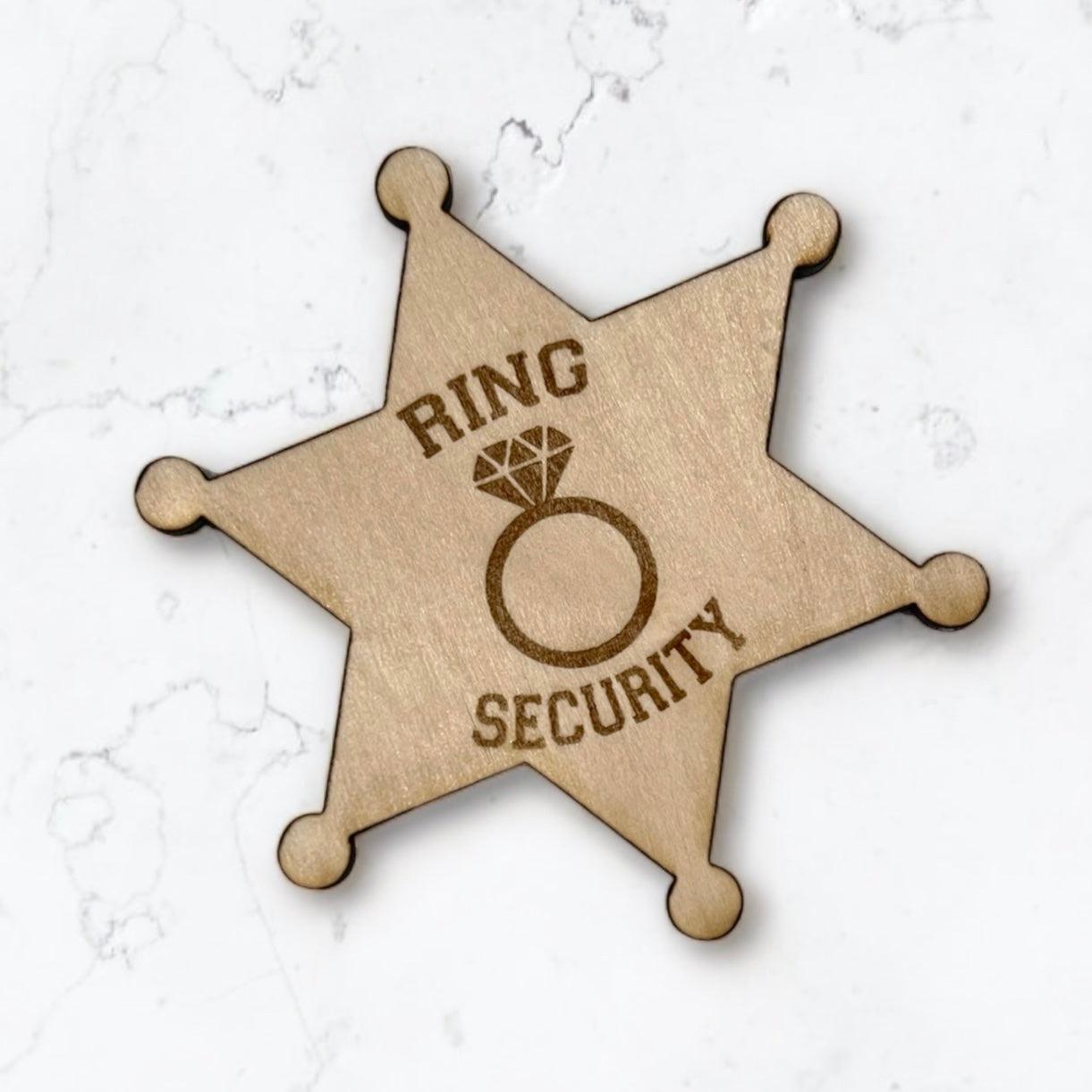 Customized personalized wooden rustic ring bearer badges for ring security badges to be worn at a wedding by ring bearers.