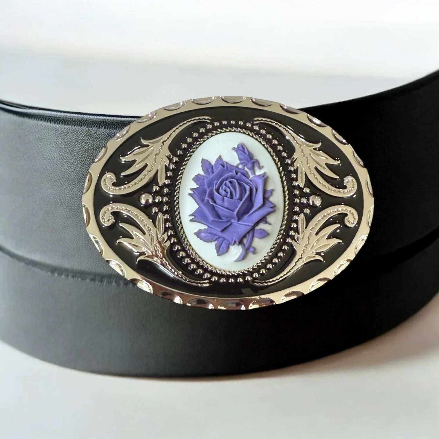 Belt buckle with purple flower in silver and black.