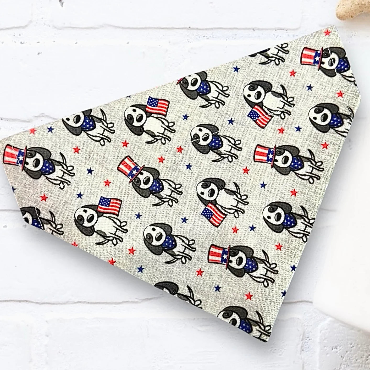 Red white and blue dog bandana with patriotic dogs.