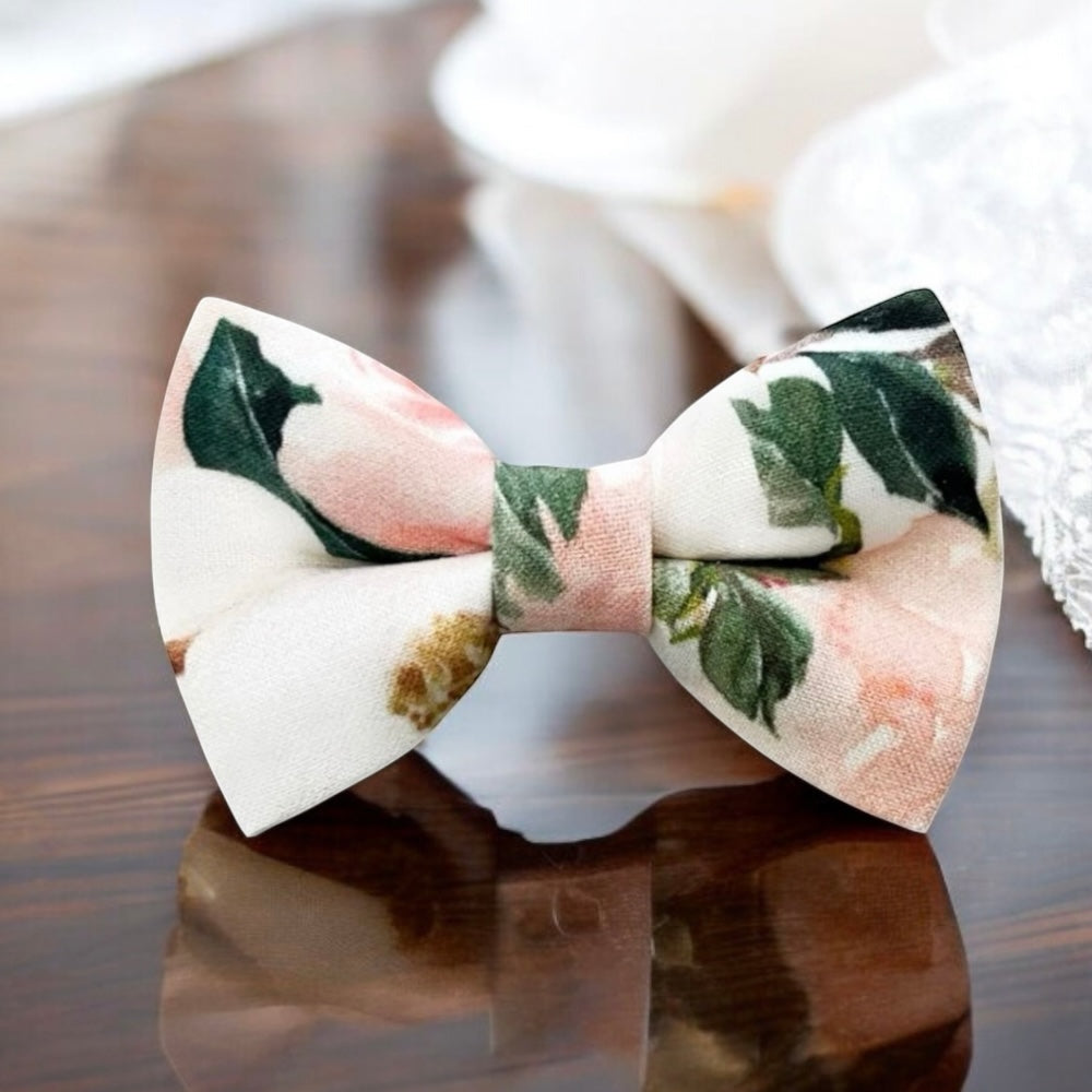 Floral bow tie for men on a reflective surface.