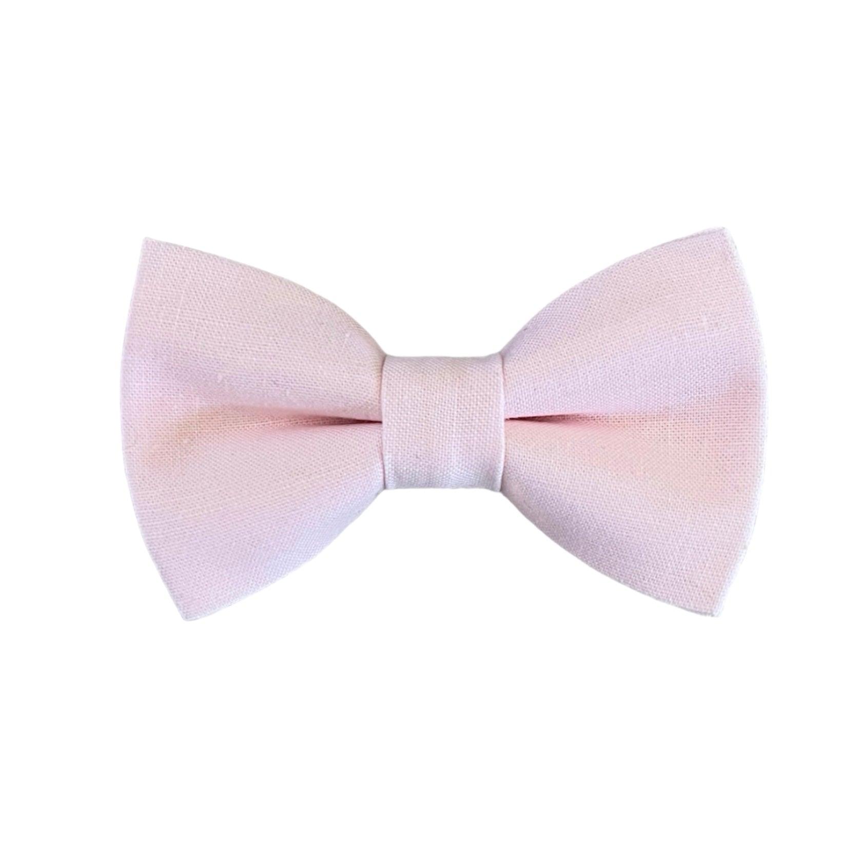 A light blush pink bow tie with an adjustable strap.