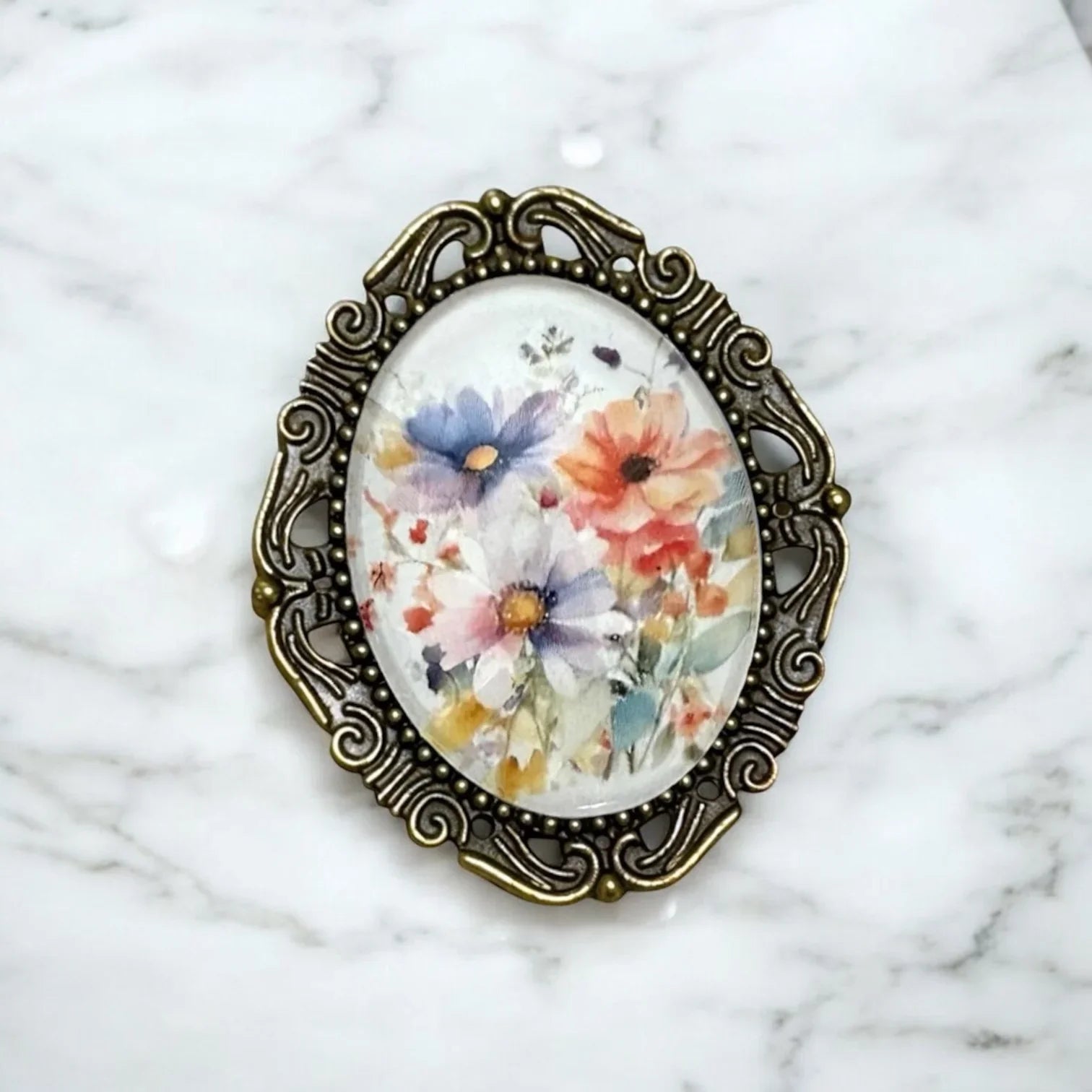 Victorian style brooch for her with floral design on a marble background