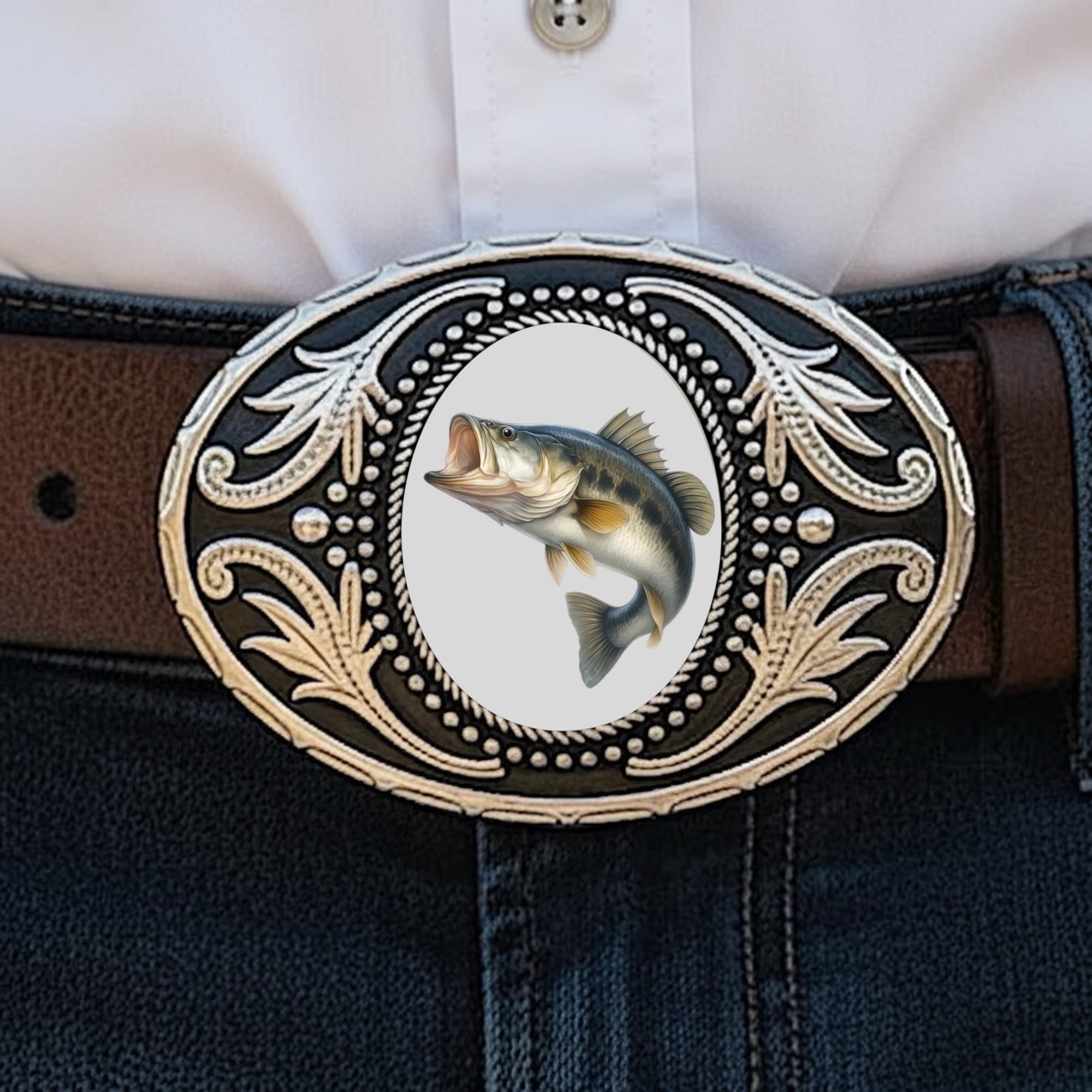Belt buckle with fish worn by a fisherman.