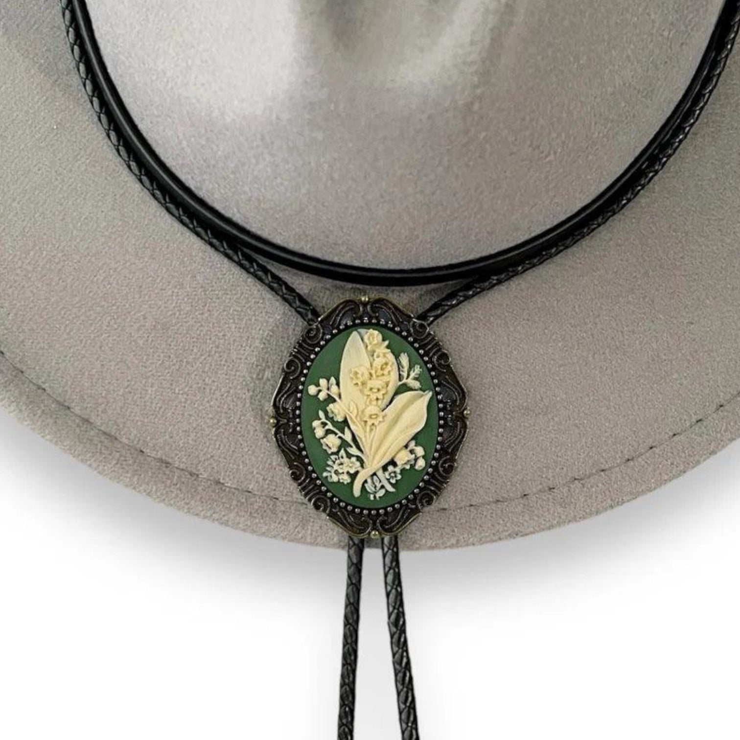 Lily of the Valley green Bolo tie with black leather cord on a cowboy hat