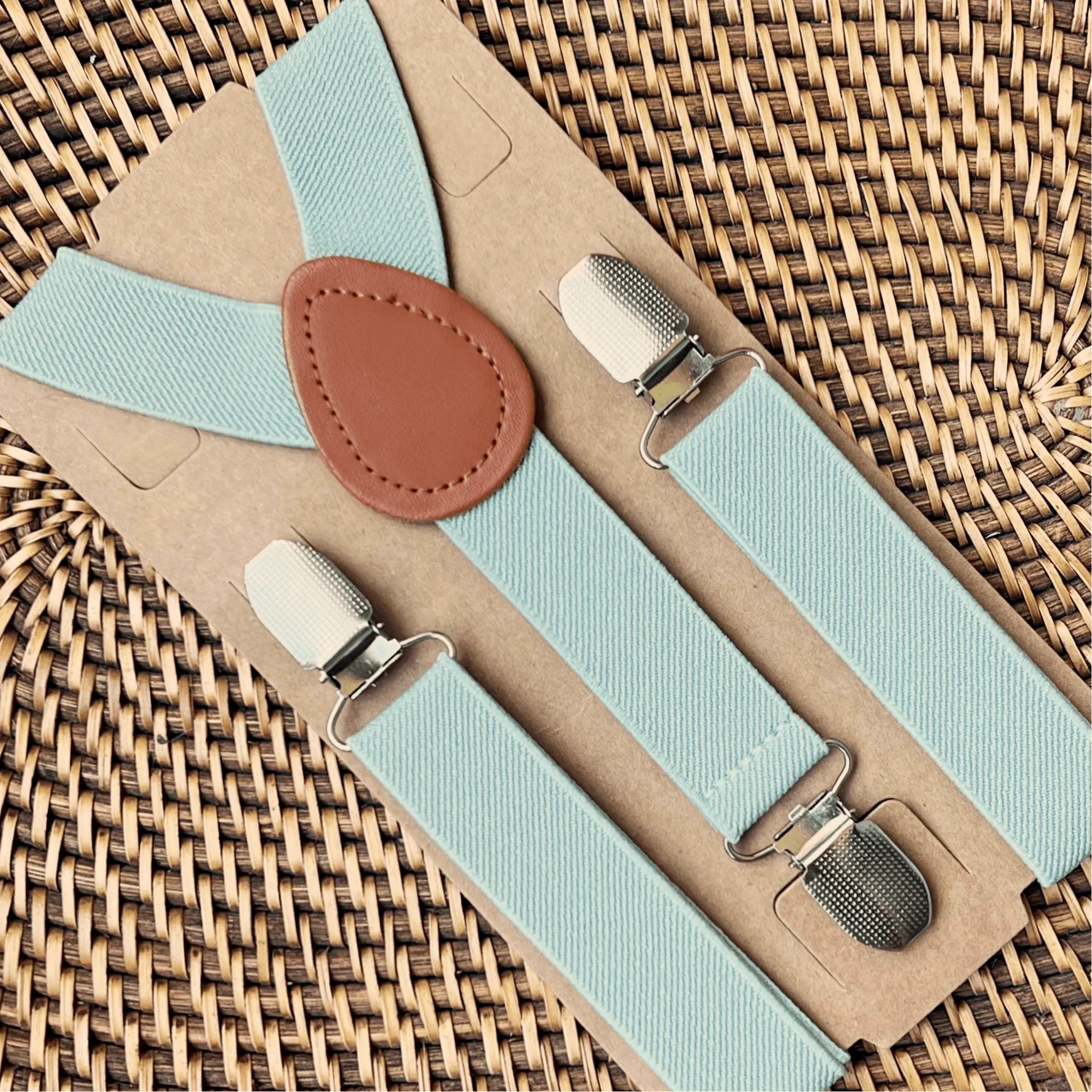 Sage Green Suspenders with Tan Leather Accents Boho Wedding Groomsmen Outfit Flat Lay Earthy Tones Rustic Style Handcrafted Adjustable Elastic Braces