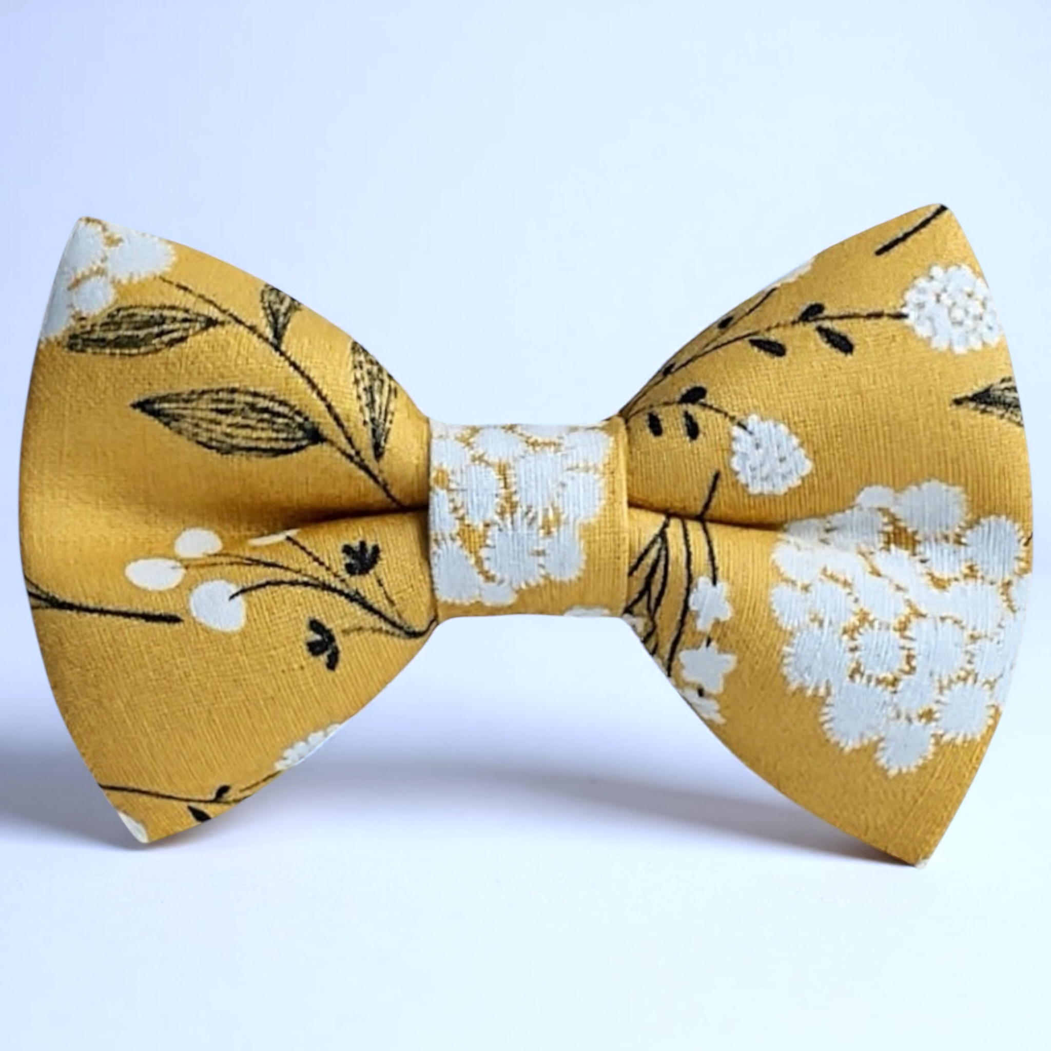 Yellow floral bow tie on a white background for a wedding