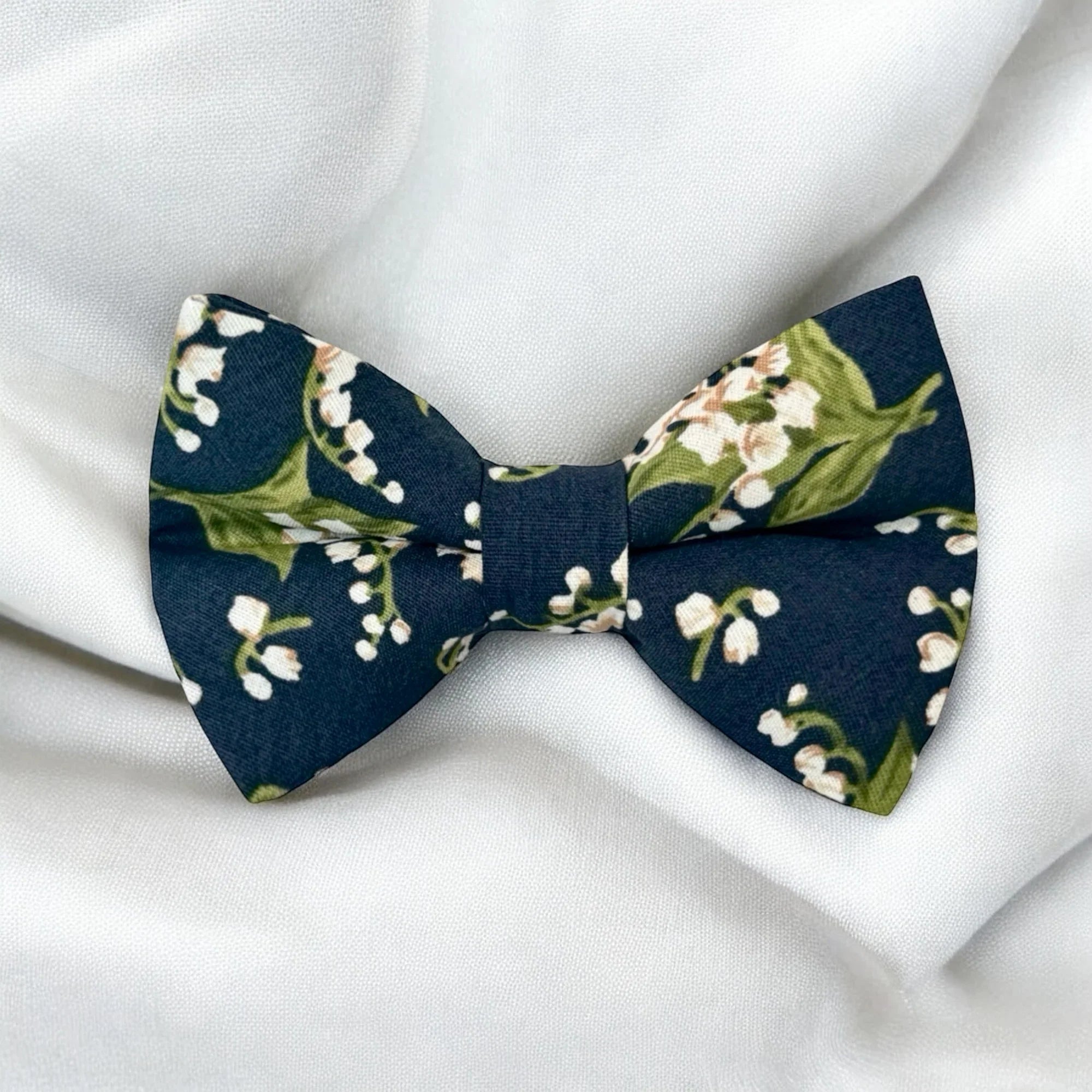 Floral bow tie with navy and white flowers for boys, toddlers, and men.
