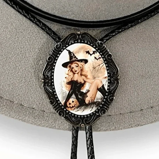 Oval pendant with a blonde witch in a black dress and hat, next to a pumpkin as bats fly in the background.
