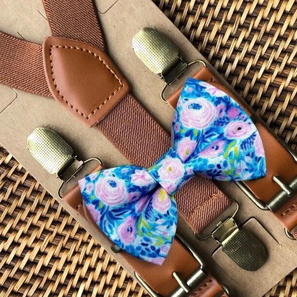 Size chart for suspender and bow tie sets from The Bold Bow Tie. X-Small (6mo-4yr): 15"-23" suspenders, 3.5" bow. Small (5-9yr): 18"-33" suspenders, 3.5" bow. Medium (10-12yr): 18"-33" suspenders, 4" bow. Adult (13yr-6'5"): 30"-53" suspenders, 4.5" bow. Big & Tall (Over 6'5"): 53"+ suspenders, 4.5" bow. Instructions note to measure from the back waistband over the shoulder to the front waistband for a comfortable fit.