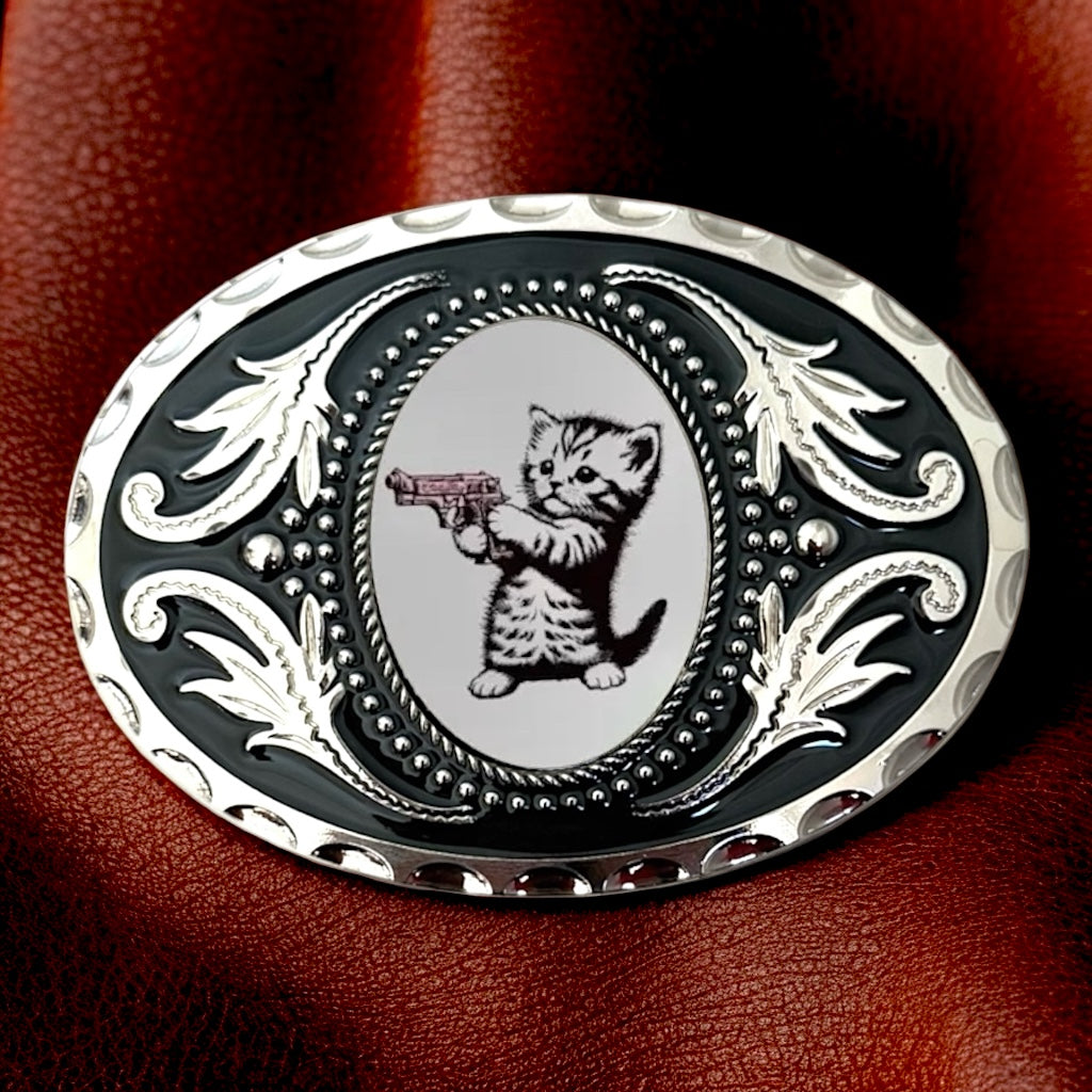 Kitten Belt Buckle Western Accessory on a leather background