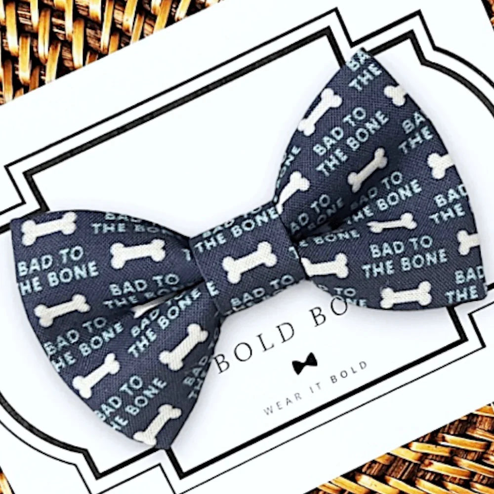 Dog Bow Tie with "Bad to the Bone" on it in white letters on navy blue background.