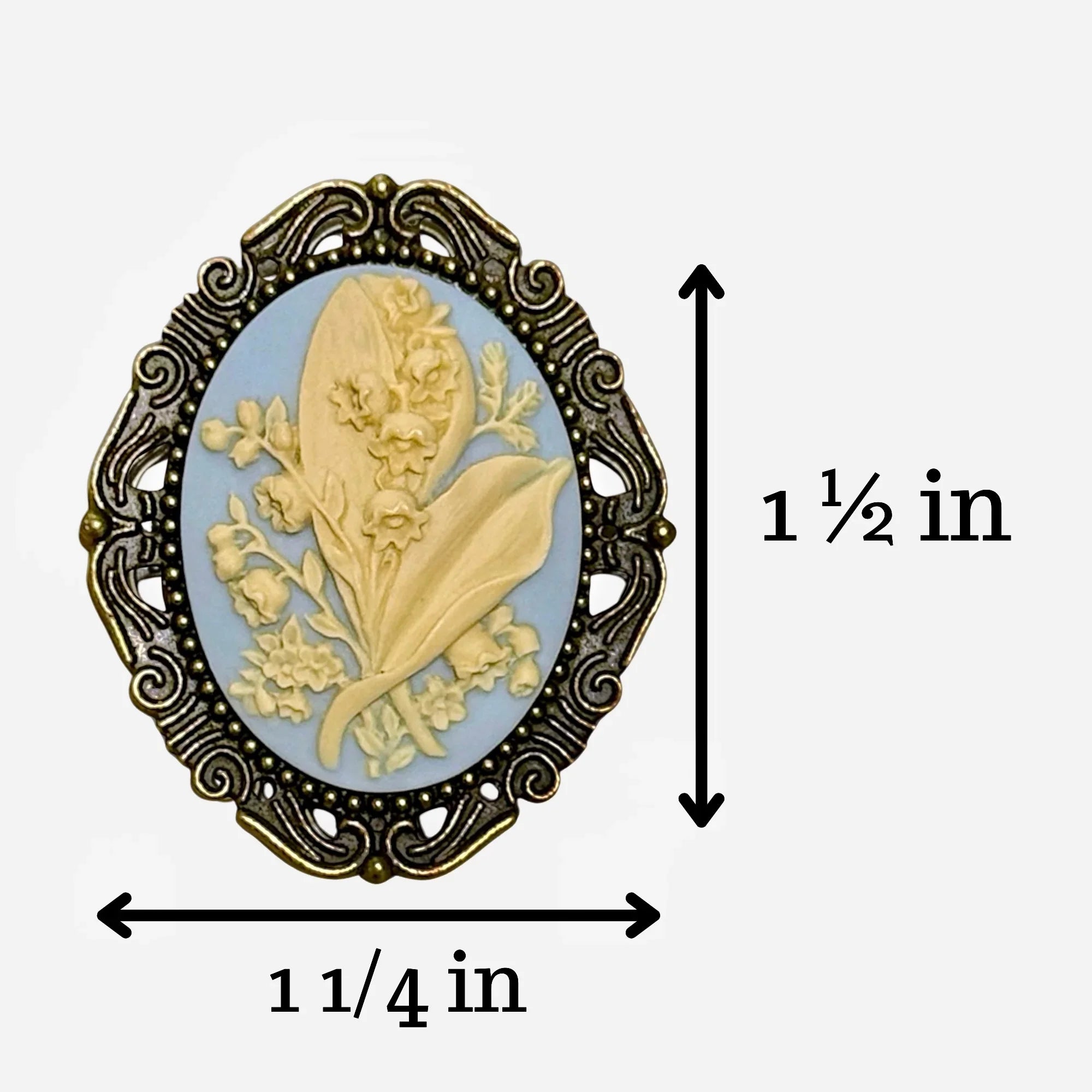 Decorative floral brooch for with measurements on a white background showing the brooch is 1 1/2 inches by 1 1/4 inches.