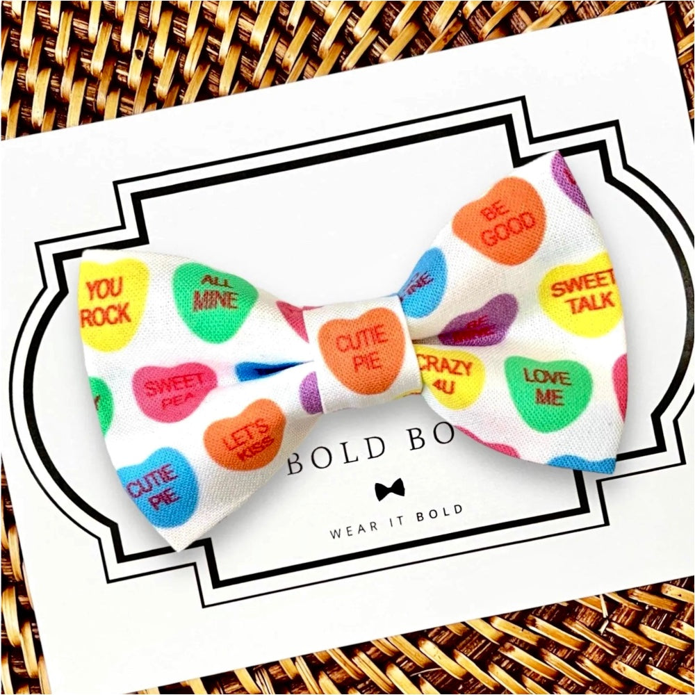 Valentines Day dog bow tie with conversation hearts.