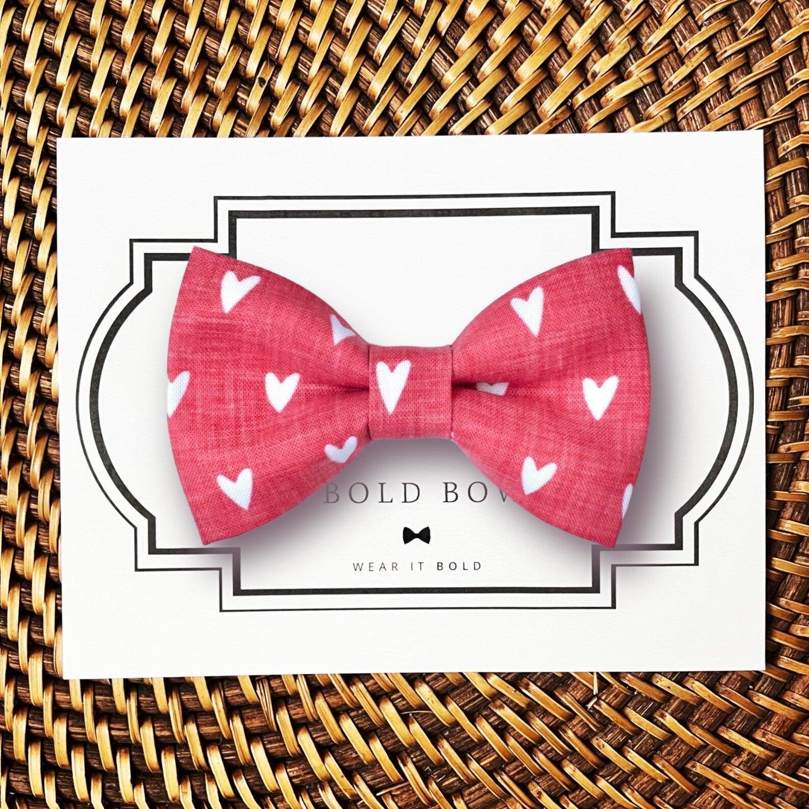 Dog bow tie size chart. Size Small is 3 1/2 inches wide for small dogs under 15 lbs. Size Medium is 4 inches wide for medium dogs between 15 band 40 lbs. Size Large is 4 1/2 inches wide for Large Dogs between 40 band 80 lbs. Size Extra Large is 5 1/2 inches wide for Extra Large Dogs over 80 lbs. Sizing is up to preference and pet bow ties slide on to dog collars with elastic.