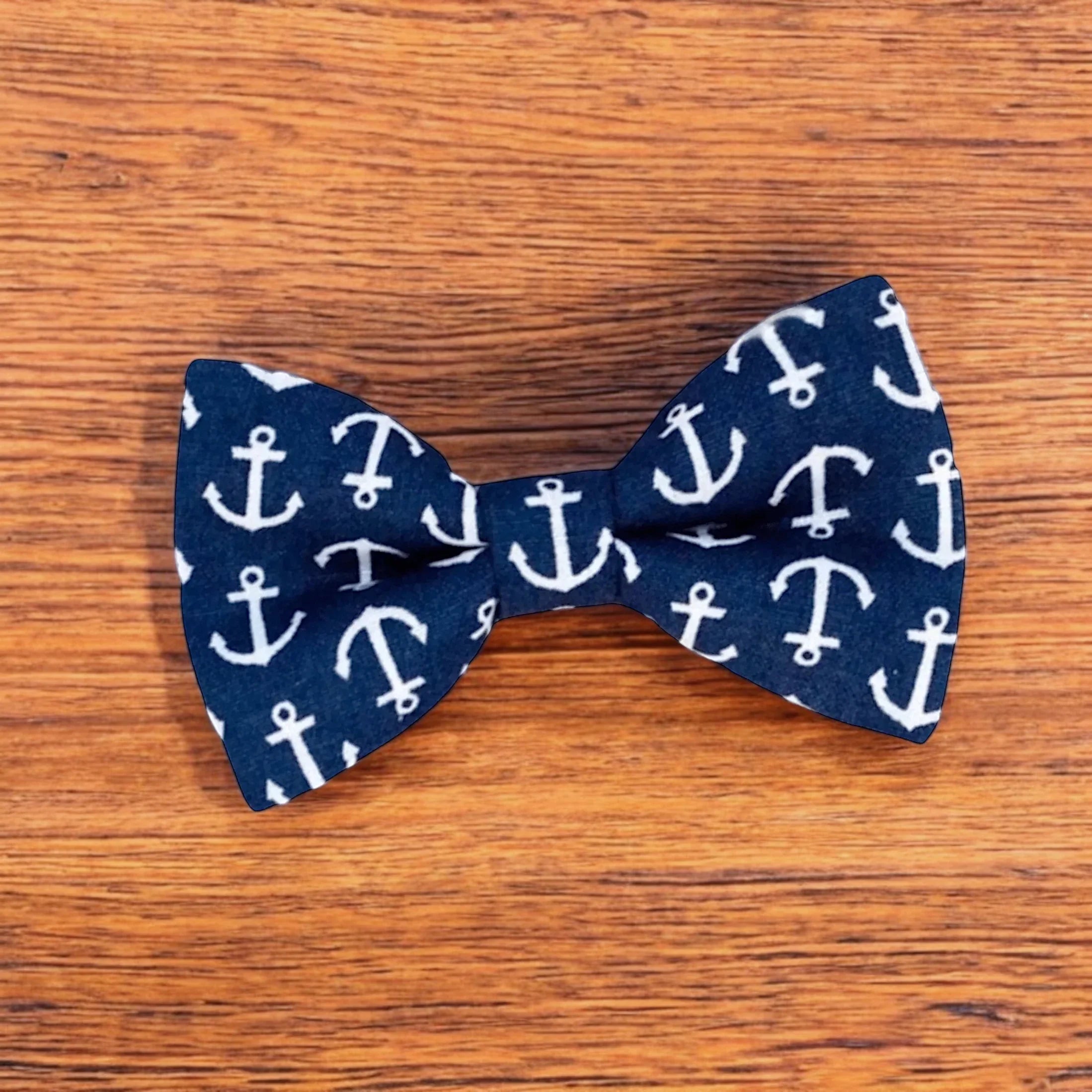 Size chart for pre-tied bow ties from The Bold Bow Tie detailing measurements across three sizes. Small is 3.5 inches wide and recommended for ages 6 months to 5 years. Medium is 4 inches wide and recommended for ages 6 to 12 years. Large is 4.5 inches wide and recommended for ages 13 years and up. Visual icons illustrate the relative sizes with horizontal arrows showing that width is measured from wingtip to wingtip. Bottom text notes that all bow ties are pre-tied and ready to add to your outfit.