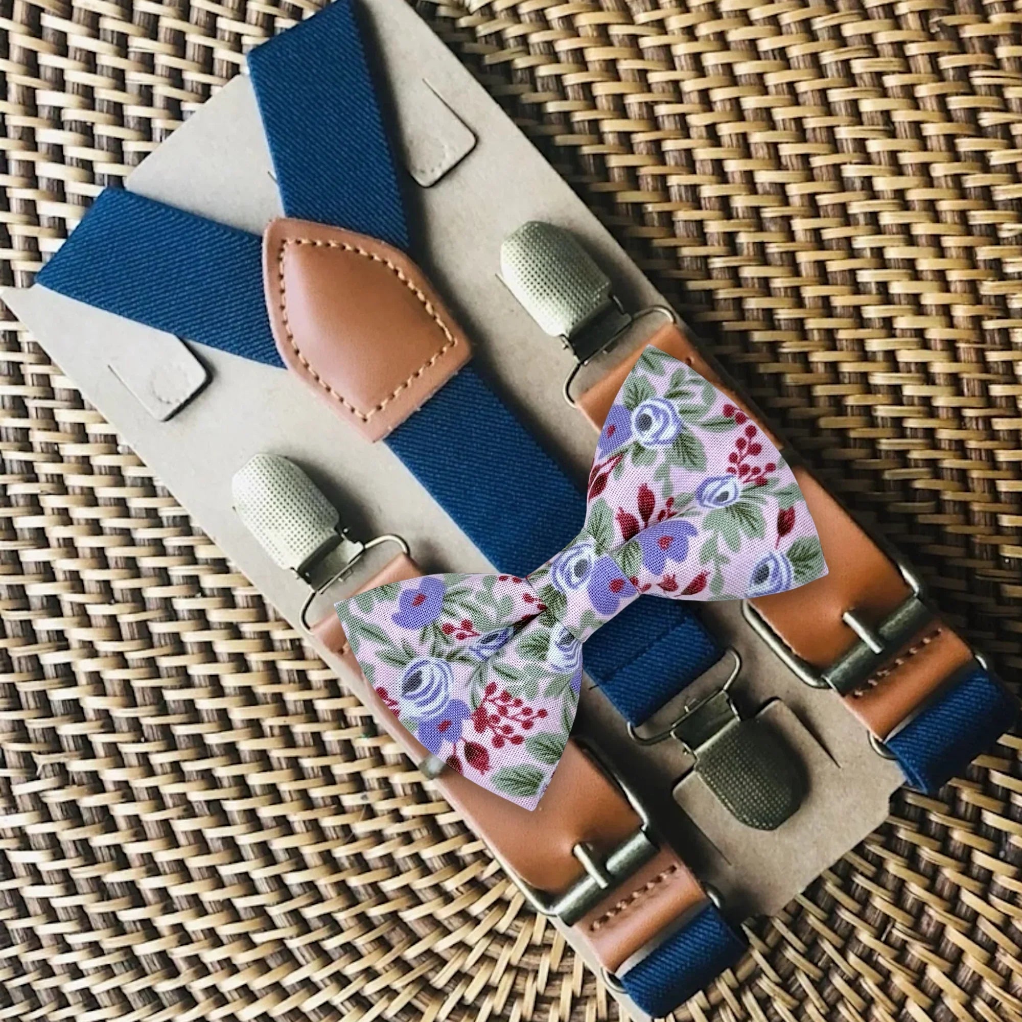Size chart for suspender and bow tie sets from The Bold Bow Tie. X-Small (6mo-4yr): 15"-23" suspenders, 3.5" bow. Small (5-9yr): 18"-33" suspenders, 3.5" bow. Medium (10-12yr): 18"-33" suspenders, 4" bow. Adult (13yr-6'5"): 30"-53" suspenders, 4.5" bow. Big & Tall (Over 6'5"): 53"+ suspenders, 4.5" bow. Instructions note to measure from the back waistband over the shoulder to the front waistband for a comfortable fit.