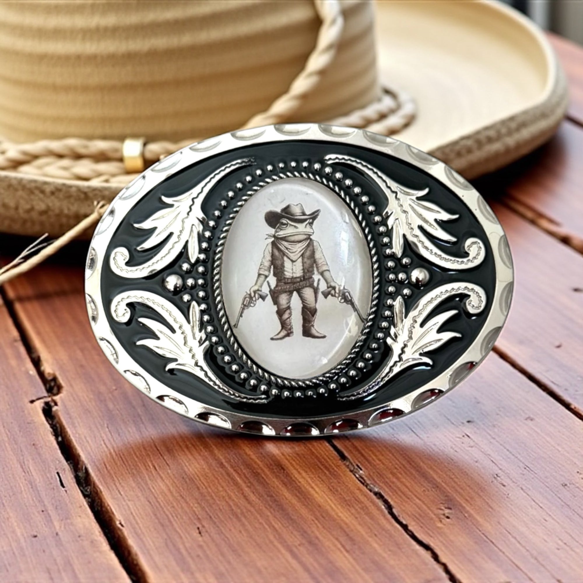 Custom Belt Buckle with Cowboy Frog, Western Accessory in front of a Cowboy hat