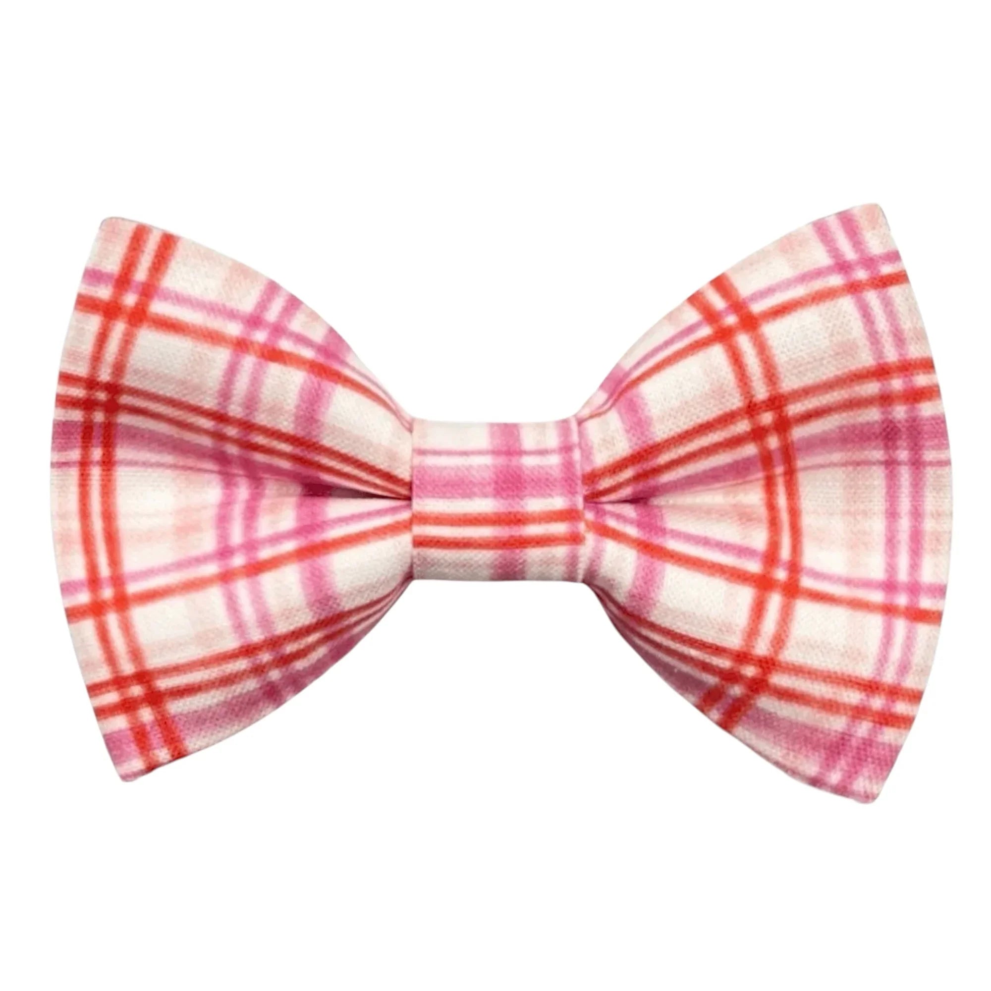 Plaid bow tie with pink and red pattern on a white background