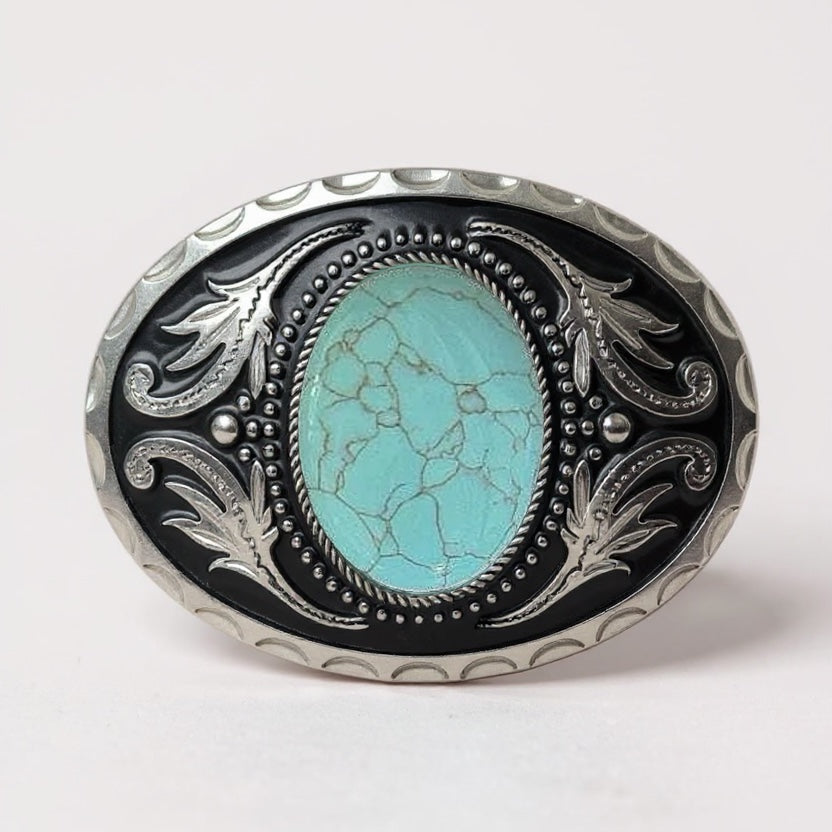 Decorative turquoise belt buckle with turquoise stone and silver detailing on a white background