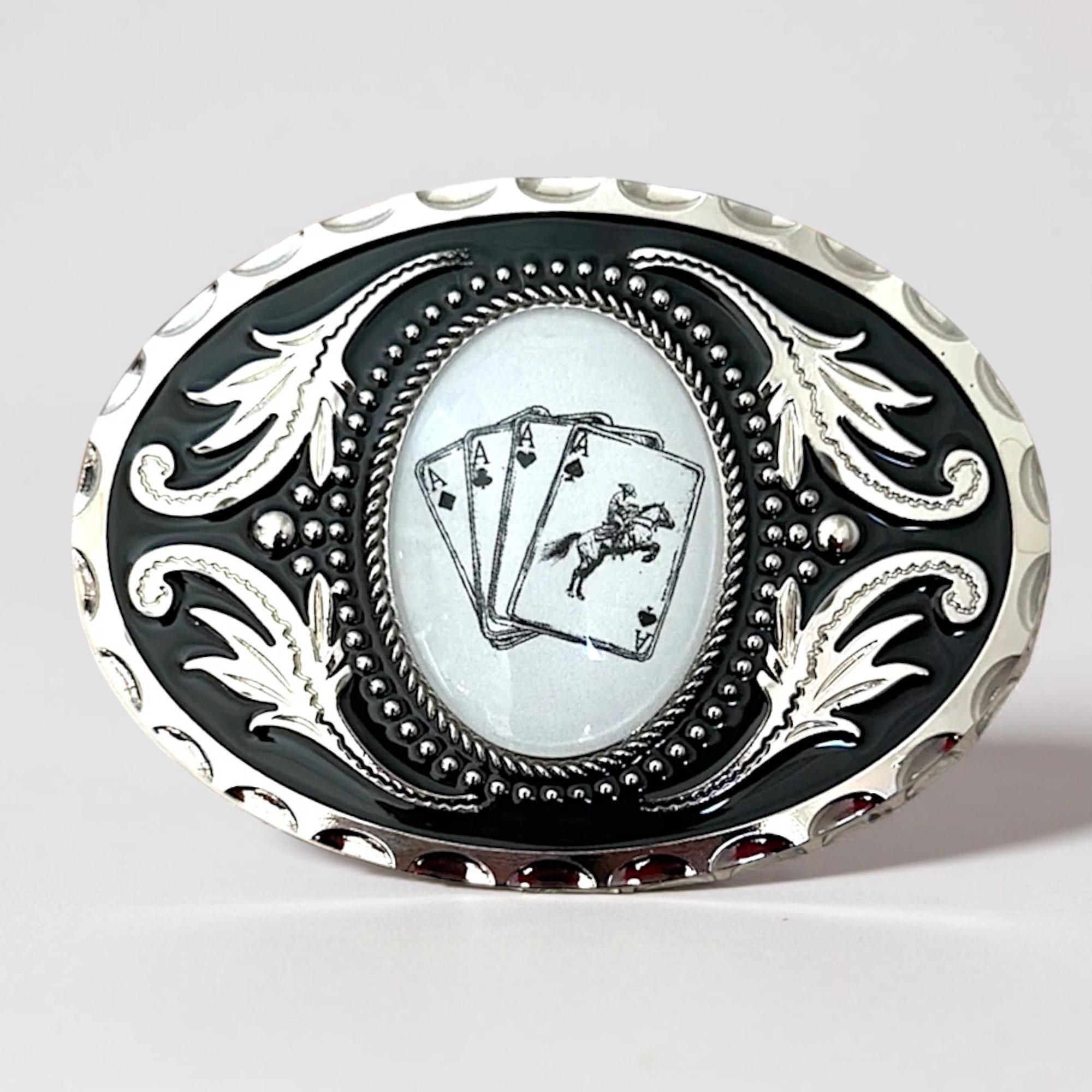Decorative Cowboy cards belt buckle with playing card design on a gray background