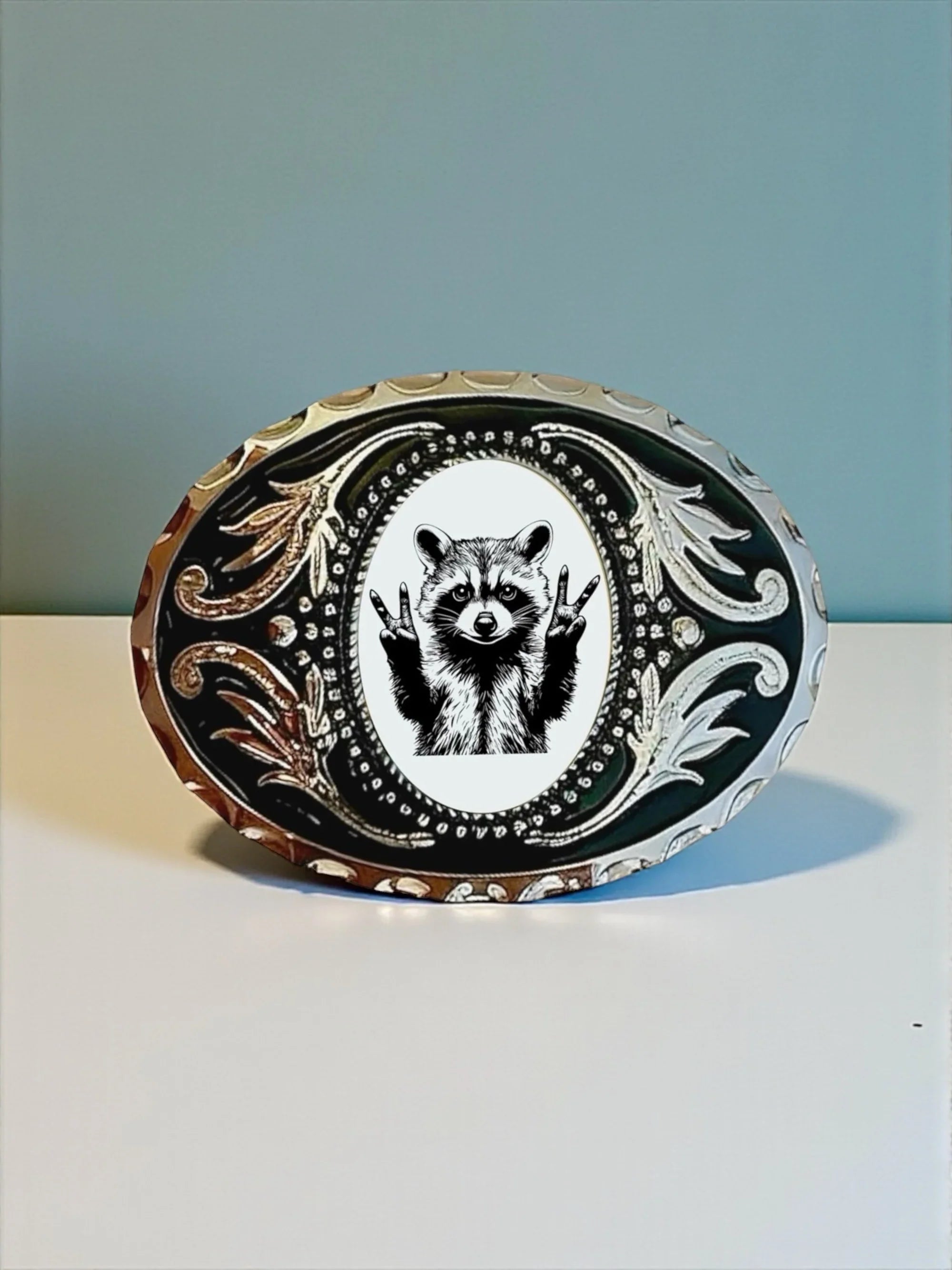 Two options for belt buckles: Option 1 has a leaf pattern and option 2 has flowers on it