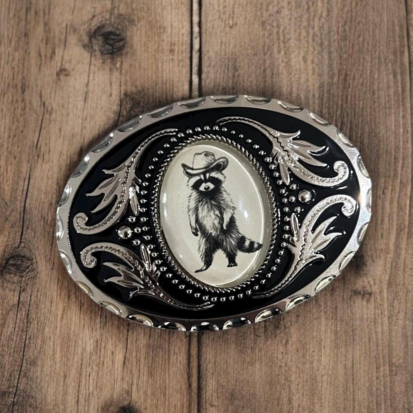Belt Buckle with Cowboy Raccoon, Western Accessory on wood table