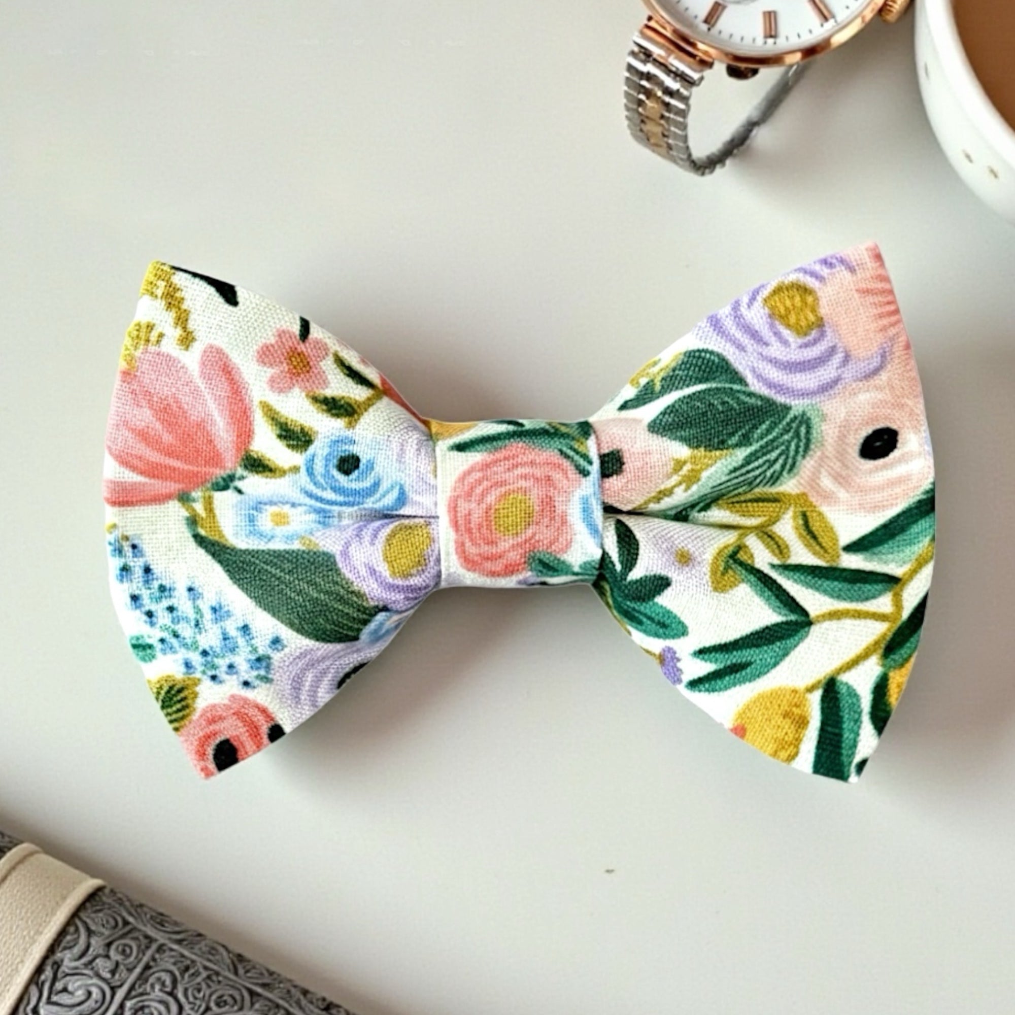 Close-up of a handmade White Floral Pre-Tied Bow Tie with a botanical pattern for wedding attire.