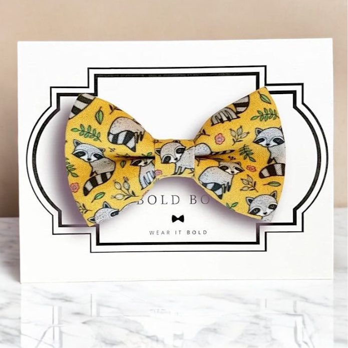 Yellow raccoon dog bow tie for dog collar.