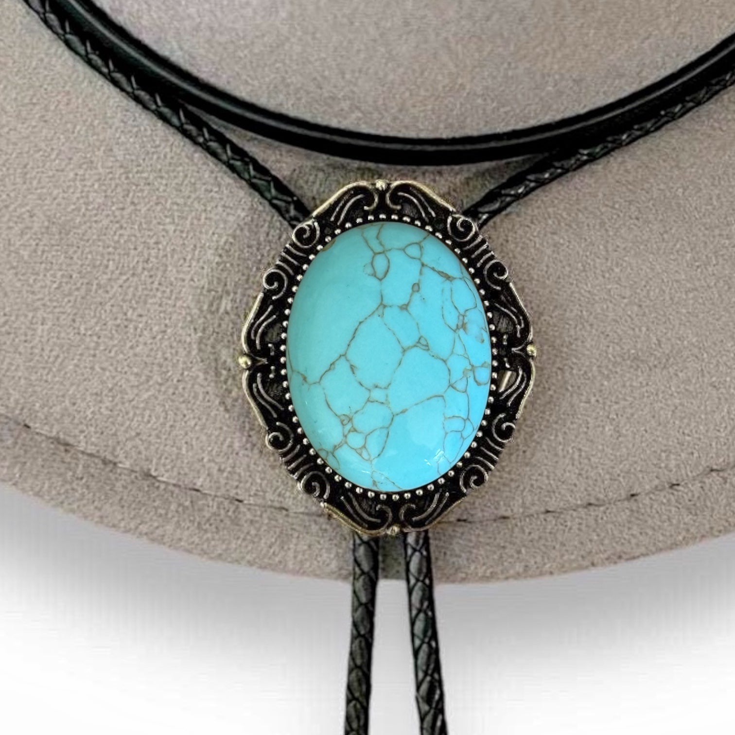 Turquoise Bolo Tie- Western Wedding Accessory for Men and Women hanging from cowboy hat