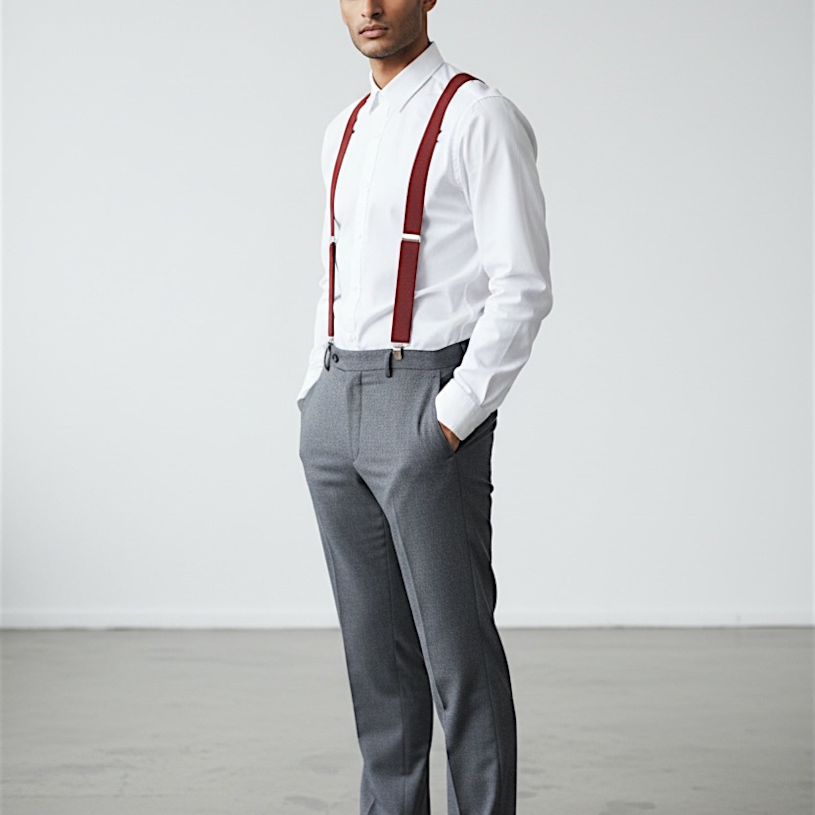 Man wearing terracotta suspenders as a groomsman in a wedding.