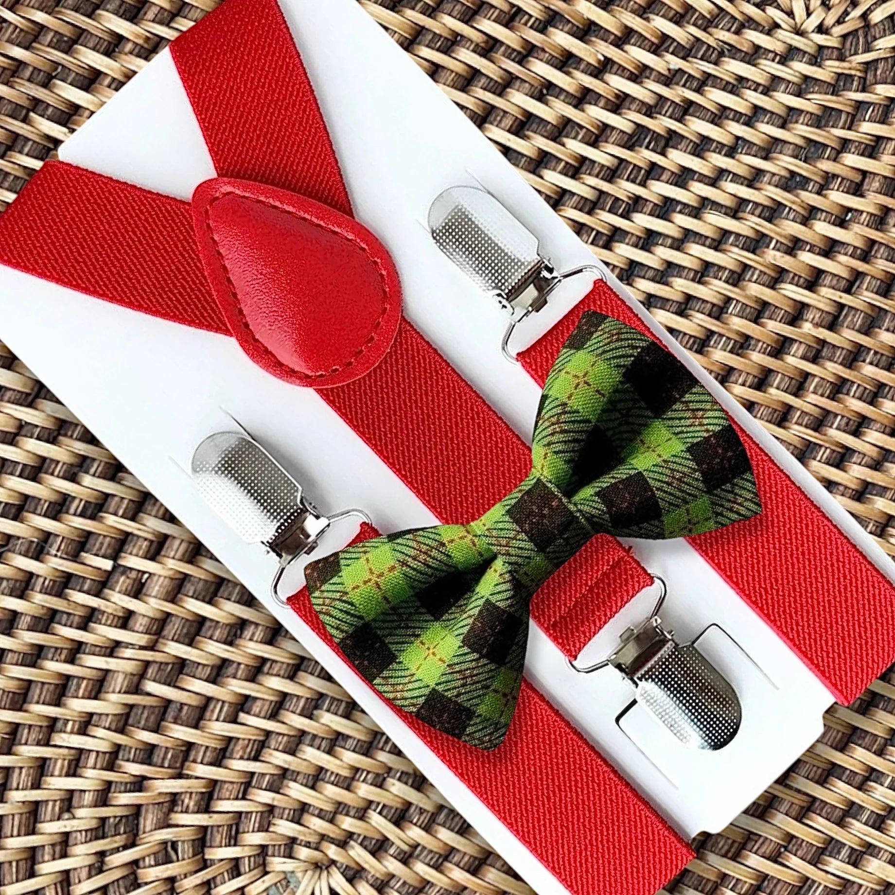 Christmas bow tie in red and green with red suspenders.