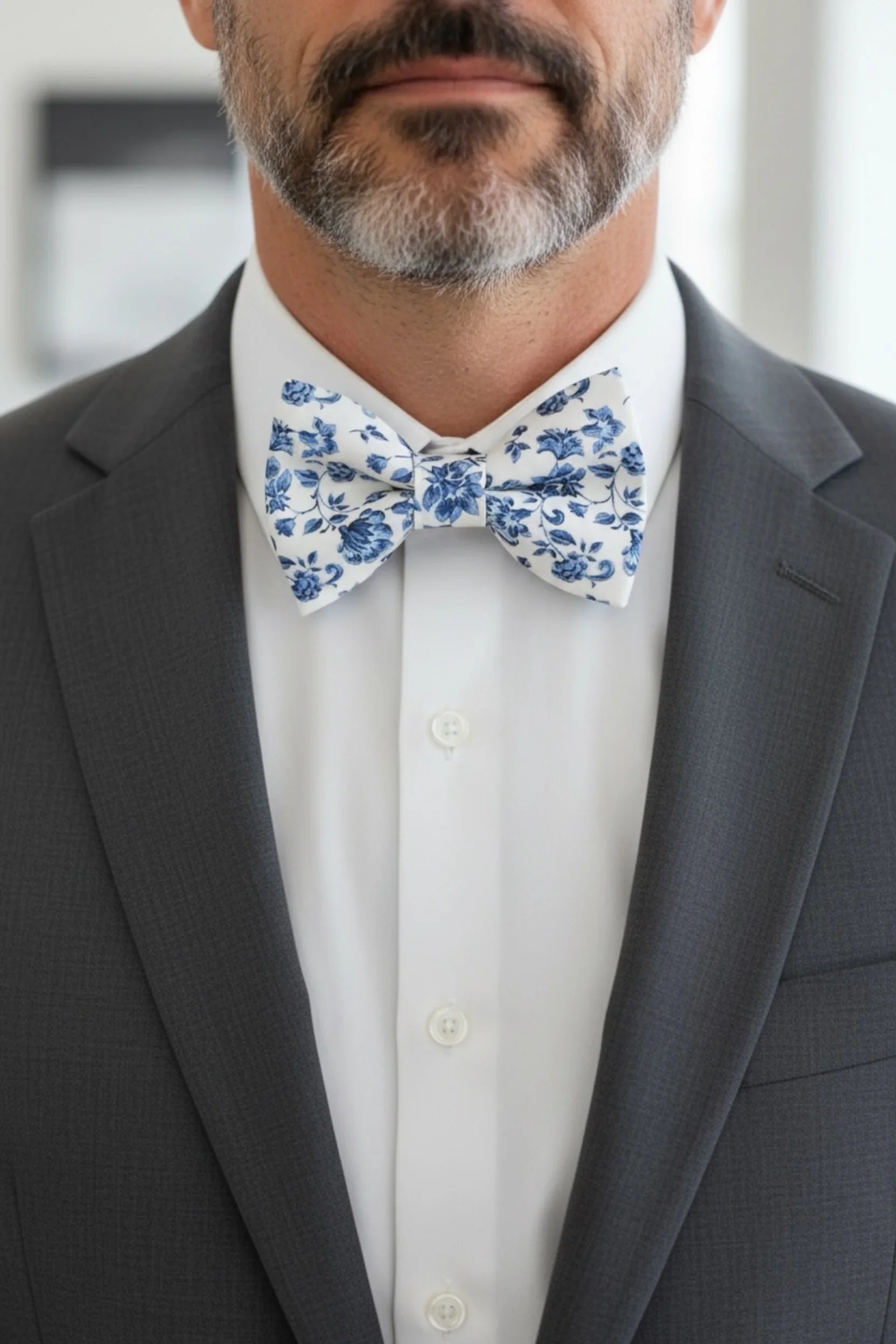 Size chart for pre-tied bow ties from The Bold Bow Tie detailing measurements across three sizes. Small is 3.5 inches wide and recommended for ages 6 months to 5 years. Medium is 4 inches wide and recommended for ages 6 to 12 years. Large is 4.5 inches wide and recommended for ages 13 years and up. Visual icons illustrate the relative sizes with horizontal arrows showing that width is measured from wingtip to wingtip. Bottom text notes that all bow ties are pre-tied and ready to add to your outfit.