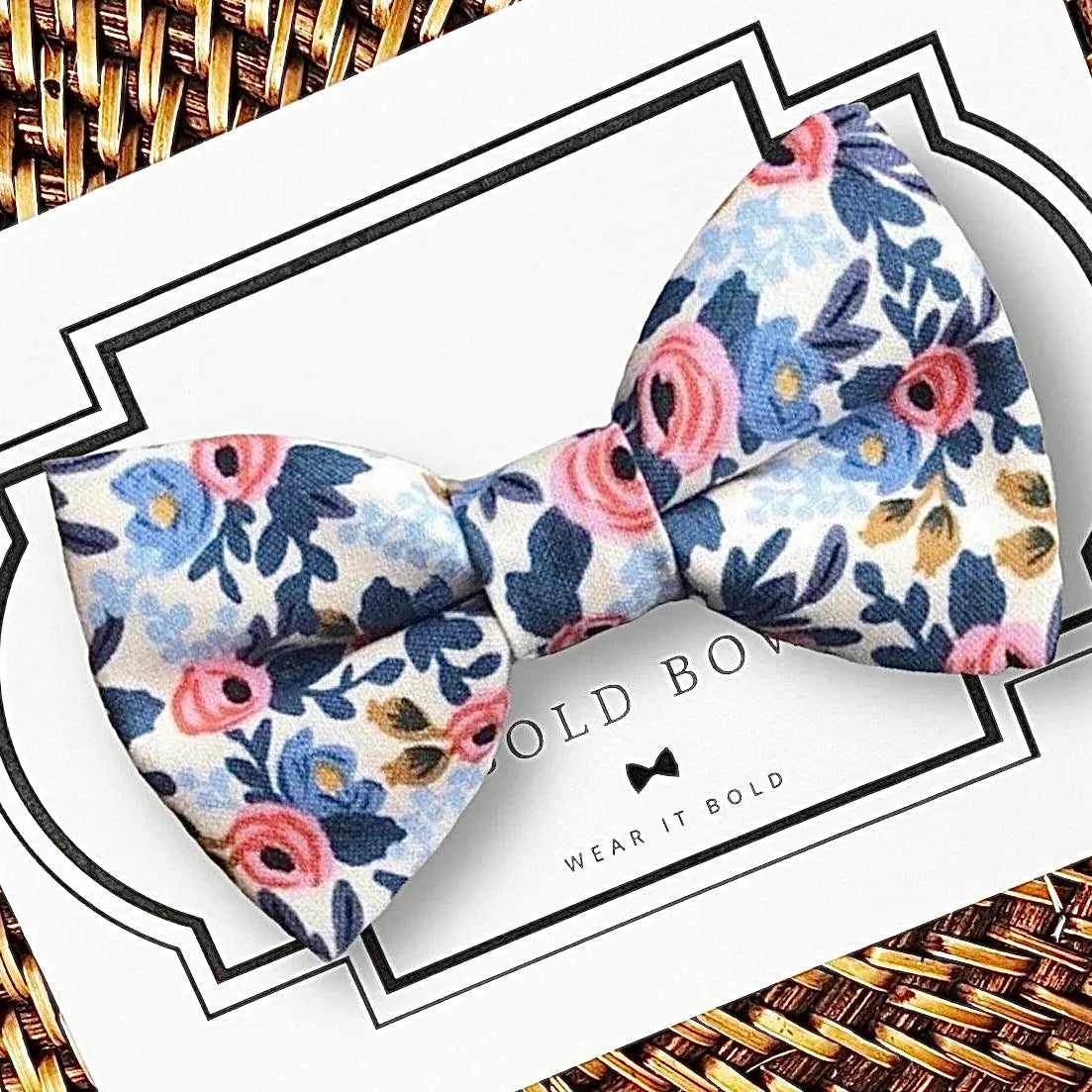 White rose floral bow tie for dog or cat collar displayed on a white card