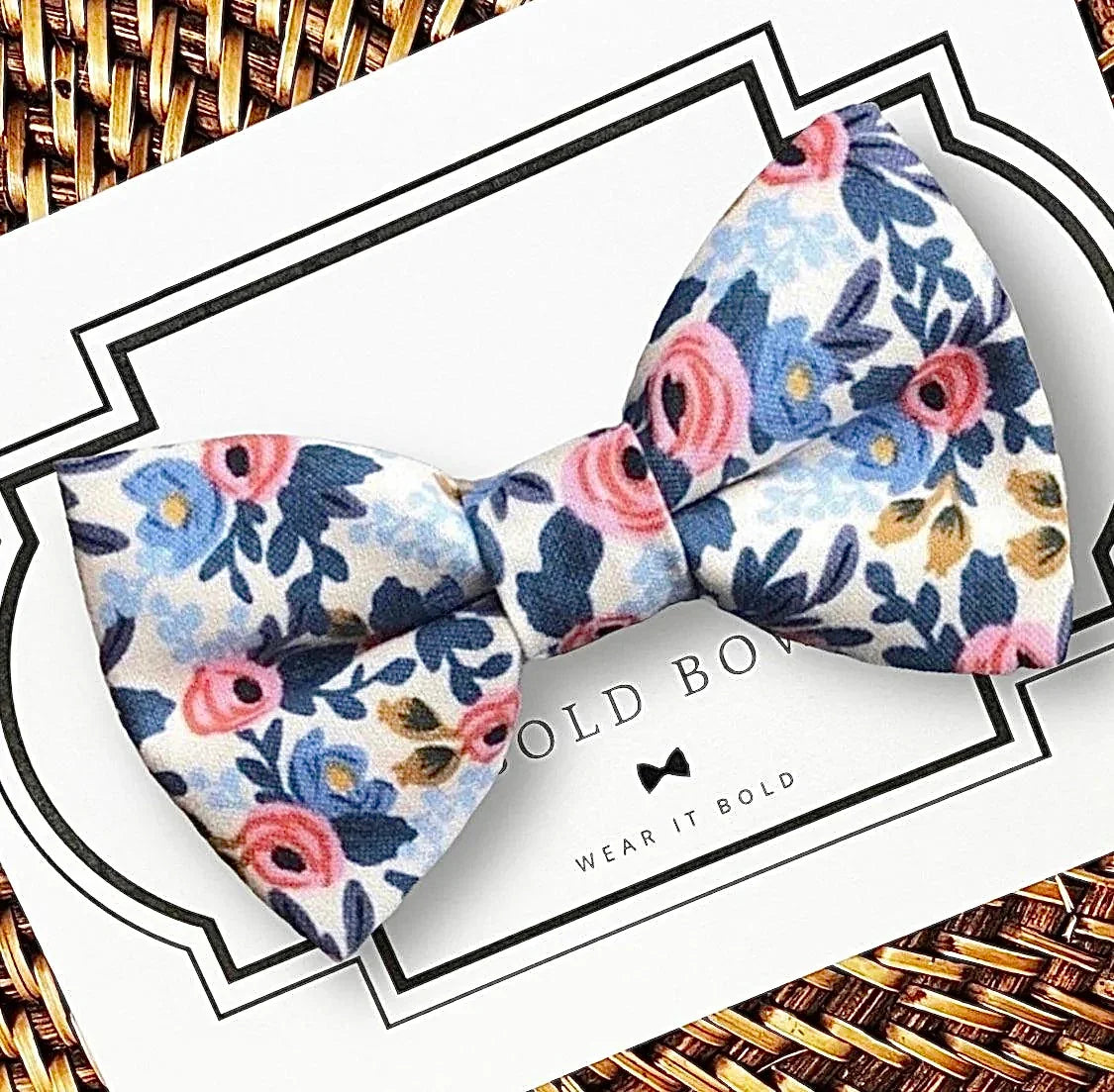 White rose floral bow tie for dog or cat collar displayed on a white card