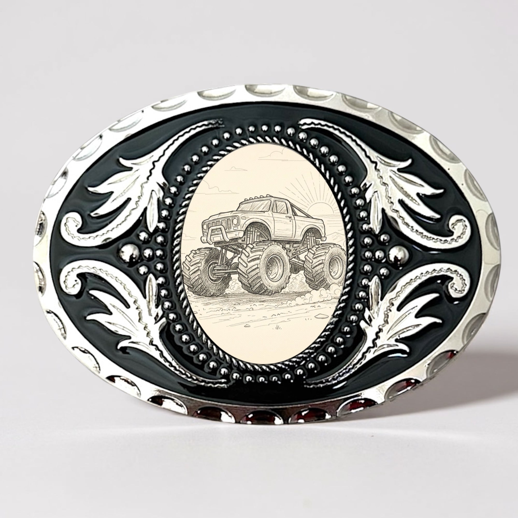 Handmade in USA Monster Truck Belt Buckle, Oval Men’s Western Accessory with silver filigree and black enamel detail.