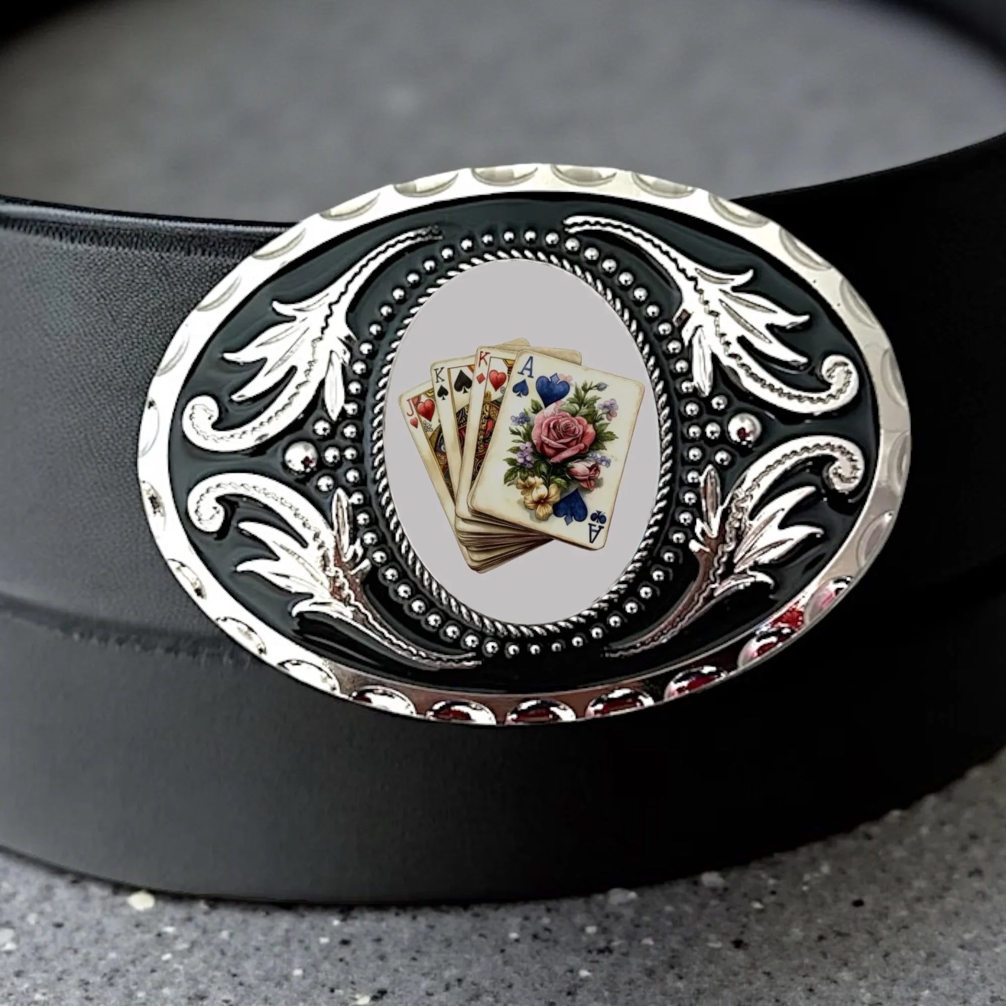 Two options for belt buckles: Option 1 has a leaf pattern and option 2 has flowers on it
