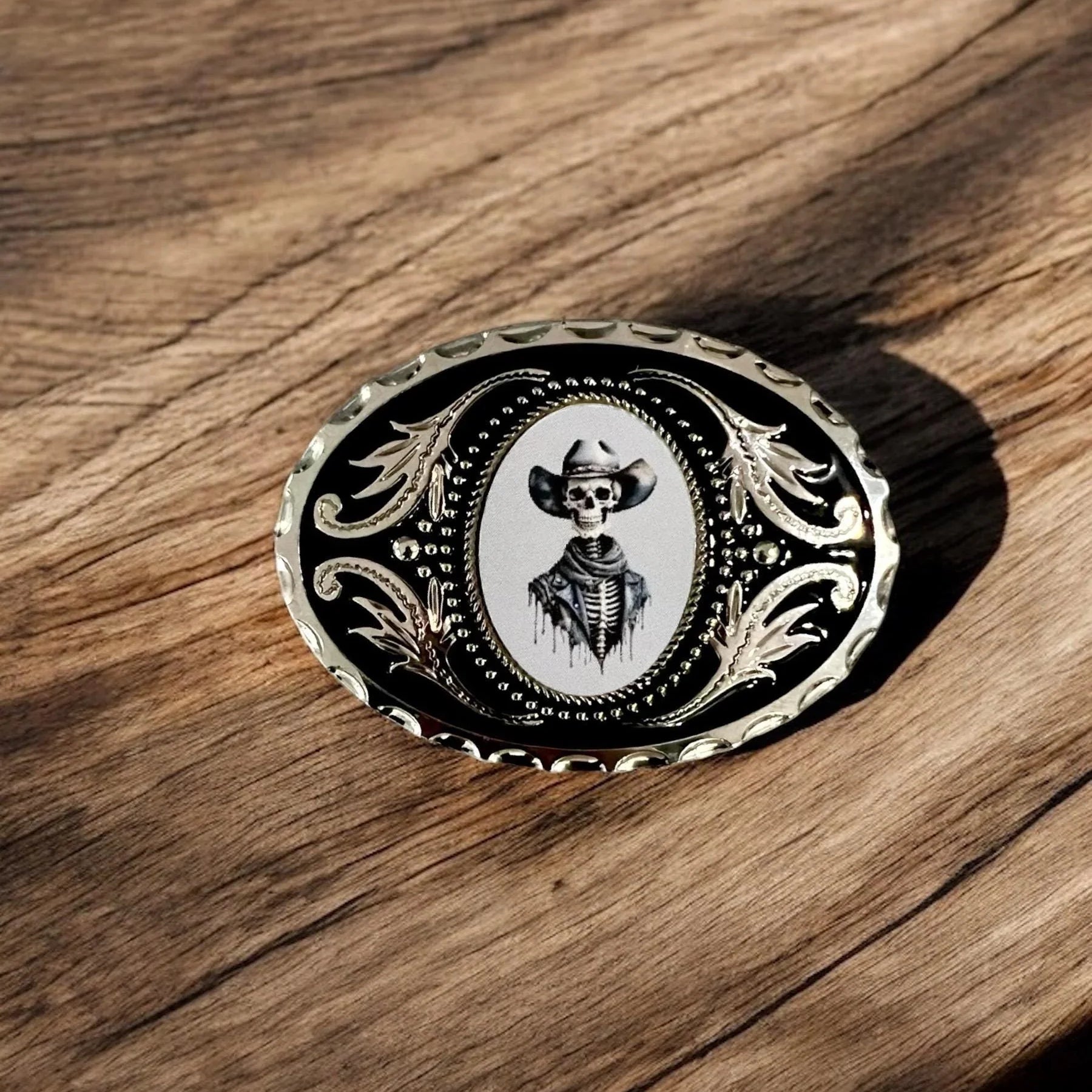 Two options for belt buckles: Option 1 has a leaf pattern and option 2 has flowers on it