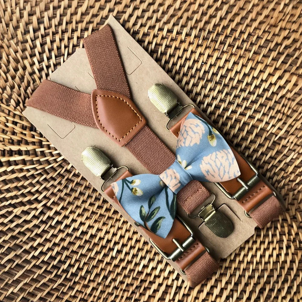 Size chart for suspender and bow tie sets from The Bold Bow Tie. X-Small (6mo-4yr): 15"-23" suspenders, 3.5" bow. Small (5-9yr): 18"-33" suspenders, 3.5" bow. Medium (10-12yr): 18"-33" suspenders, 4" bow. Adult (13yr-6'5"): 30"-53" suspenders, 4.5" bow. Big & Tall (Over 6'5"): 53"+ suspenders, 4.5" bow. Instructions note to measure from the back waistband over the shoulder to the front waistband for a comfortable fit.