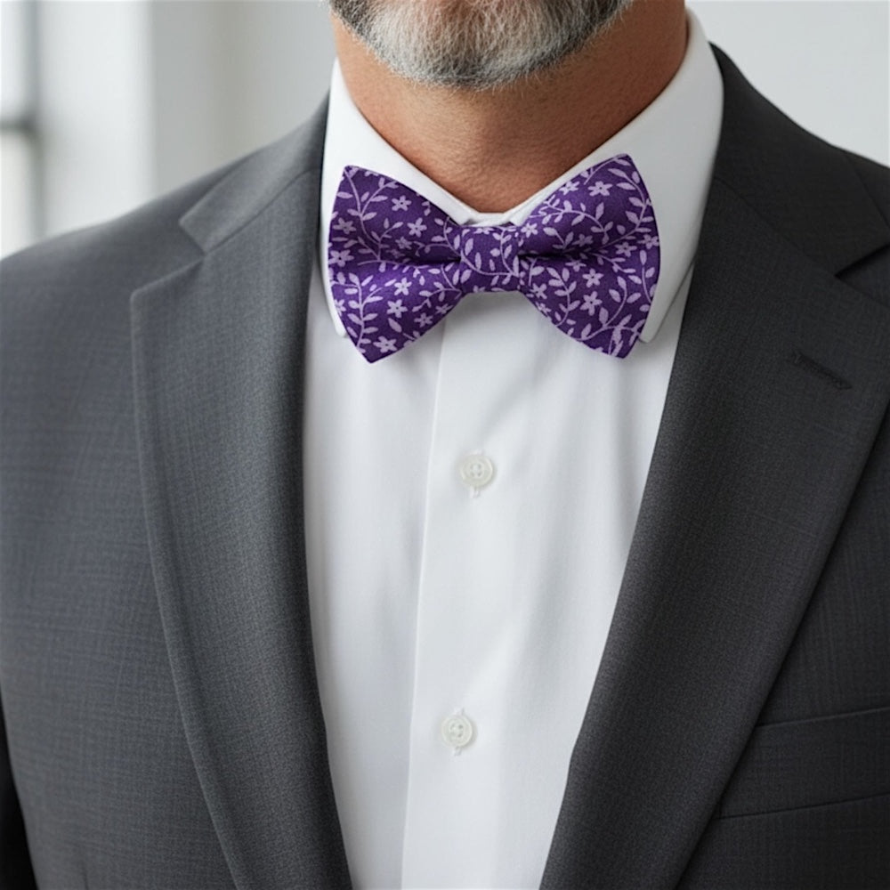 Size chart for pre-tied bow ties from The Bold Bow Tie detailing measurements across three sizes. Small is 3.5 inches wide and recommended for ages 6 months to 5 years. Medium is 4 inches wide and recommended for ages 6 to 12 years. Large is 4.5 inches wide and recommended for ages 13 years and up. Visual icons illustrate the relative sizes with horizontal arrows showing that width is measured from wingtip to wingtip. Bottom text notes that all bow ties are pre-tied and ready to add to your outfit.