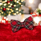 Red Tartan Plaid Bow Tie in front of a Christmas tree
