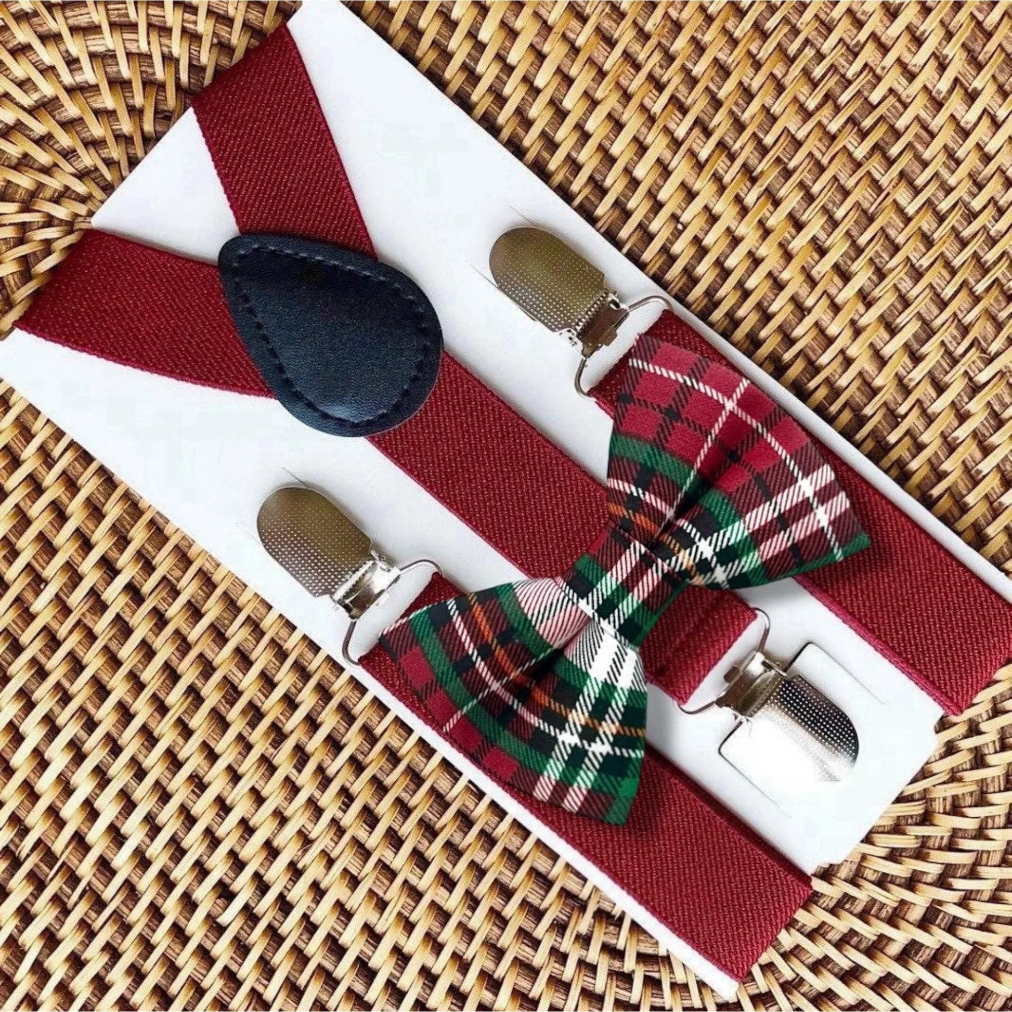 Dark red bow tie and suspenders in plaid for Christmas.