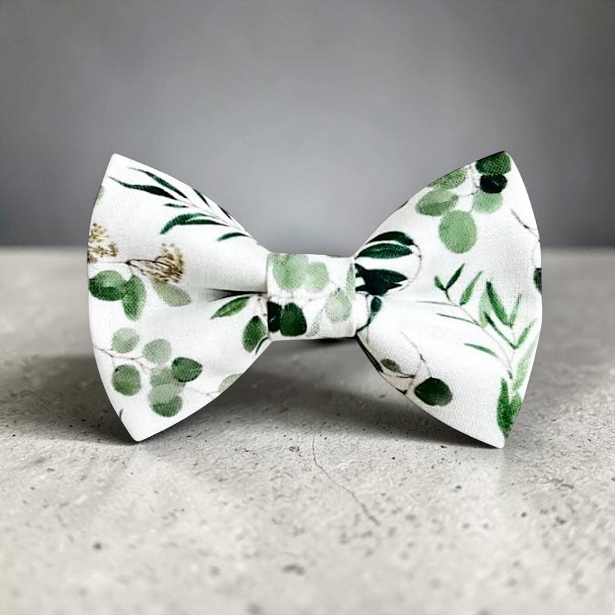 Floral bow tie for men on a gray background.