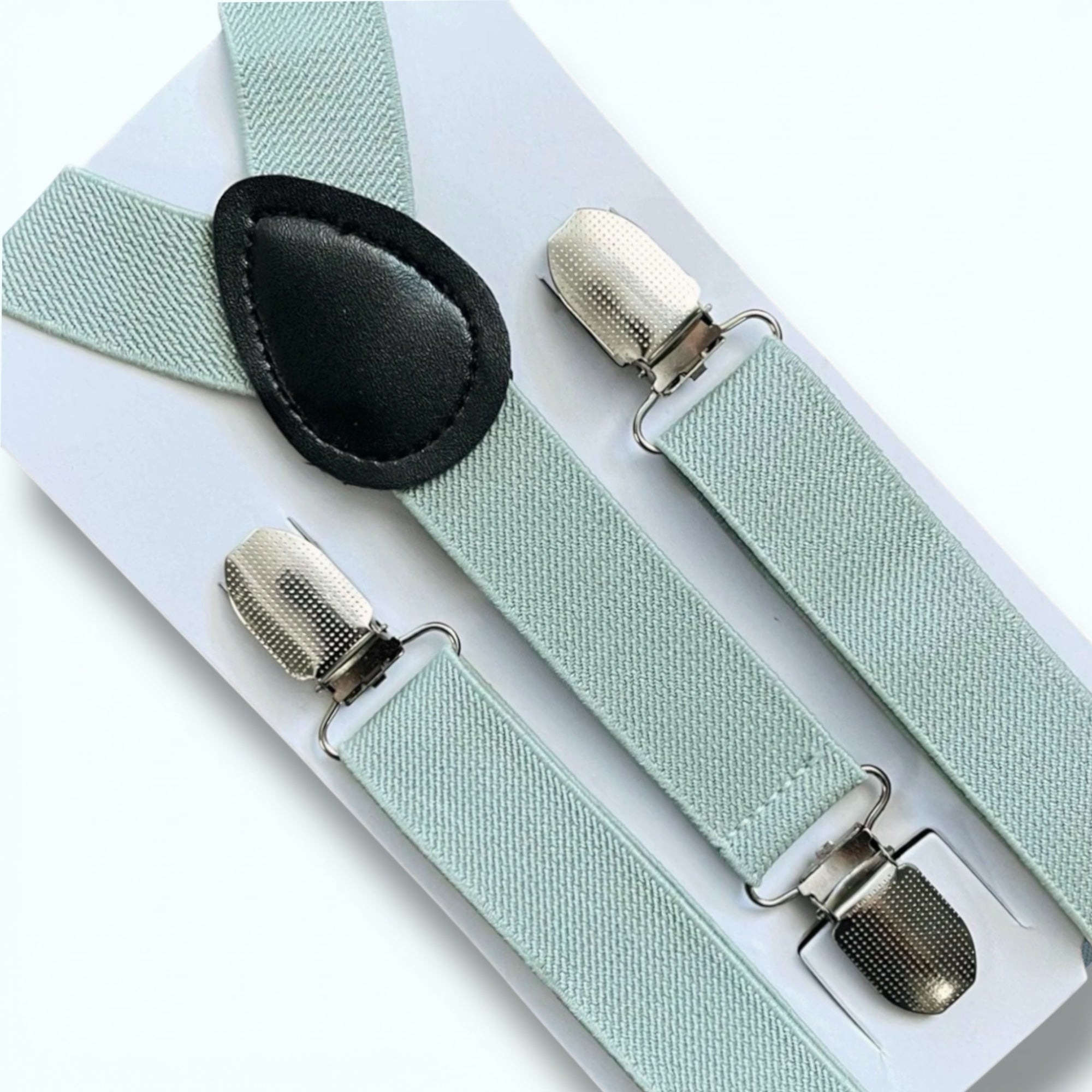 Sage green suspenders with silver clips for groomsmen, ring bearer and wedding suspenders on a white background