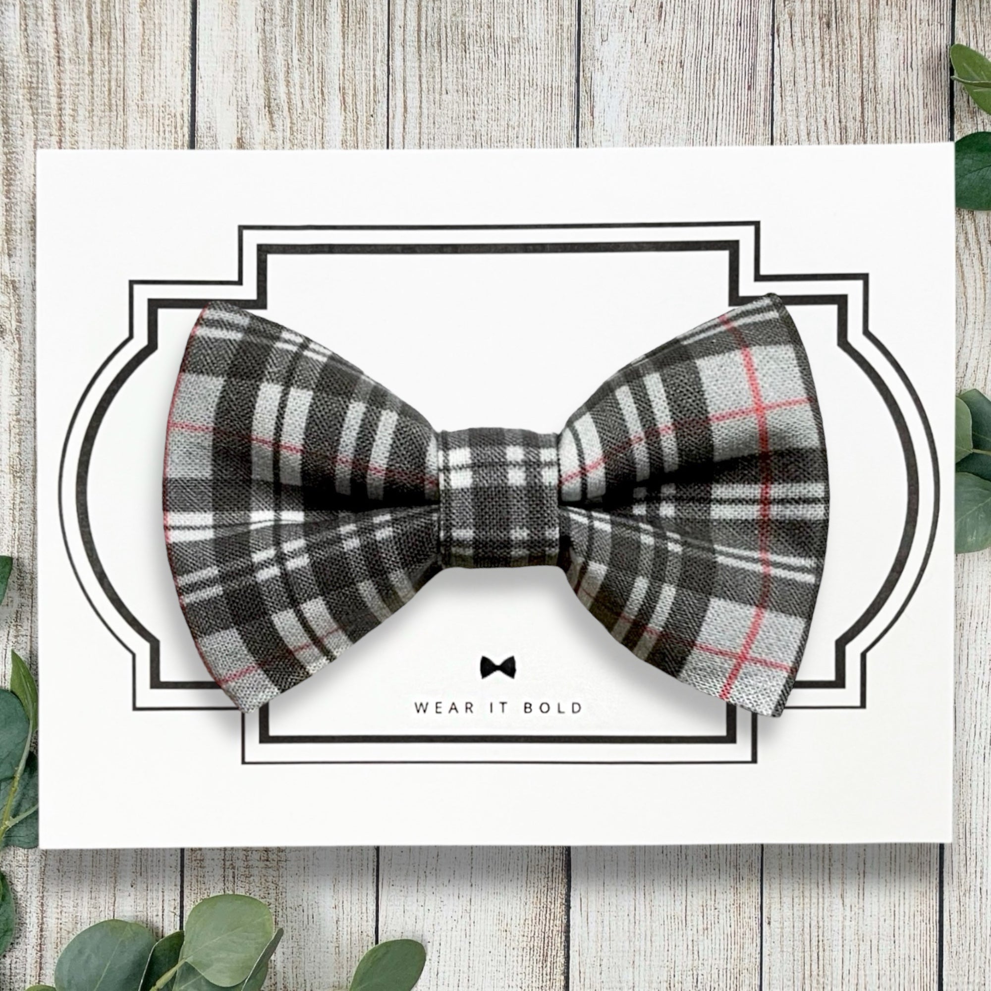 Gray Plaid Dog Bow Tie on a wooden table