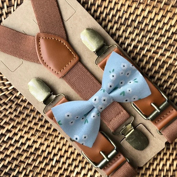 Dusty blue floral bow tie with brown suspenders