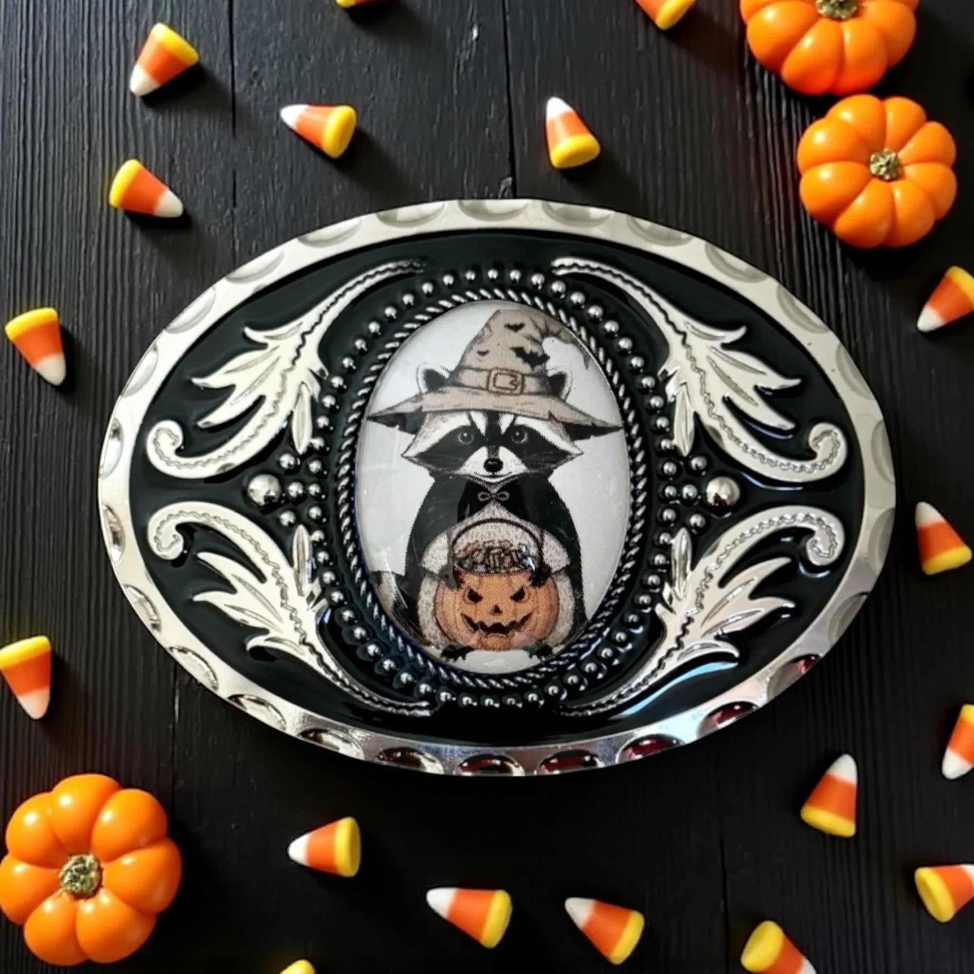 Two options for belt buckles: Option 1 has a leaf pattern and option 2 has flowers on it