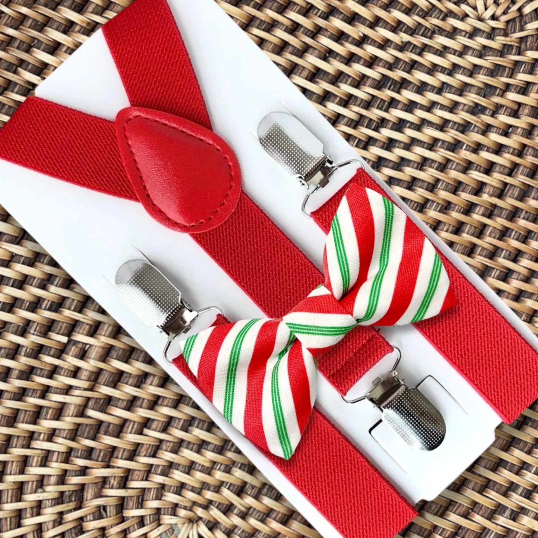 Christmas bow tie and suspenders in red and green stripes.