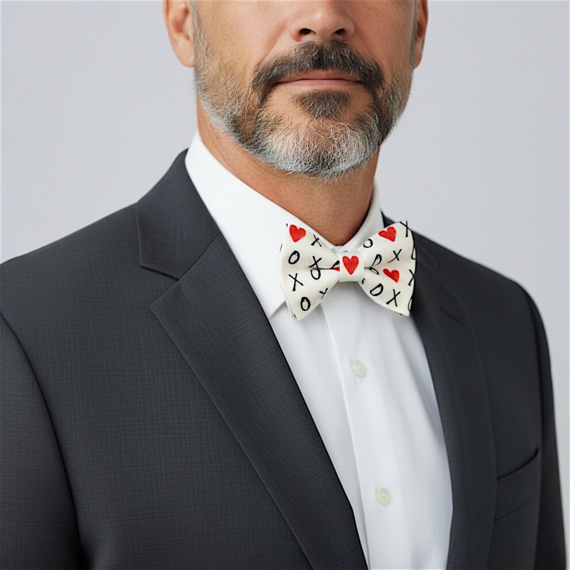 Valentines Day bow tie worn by a man in a suit.