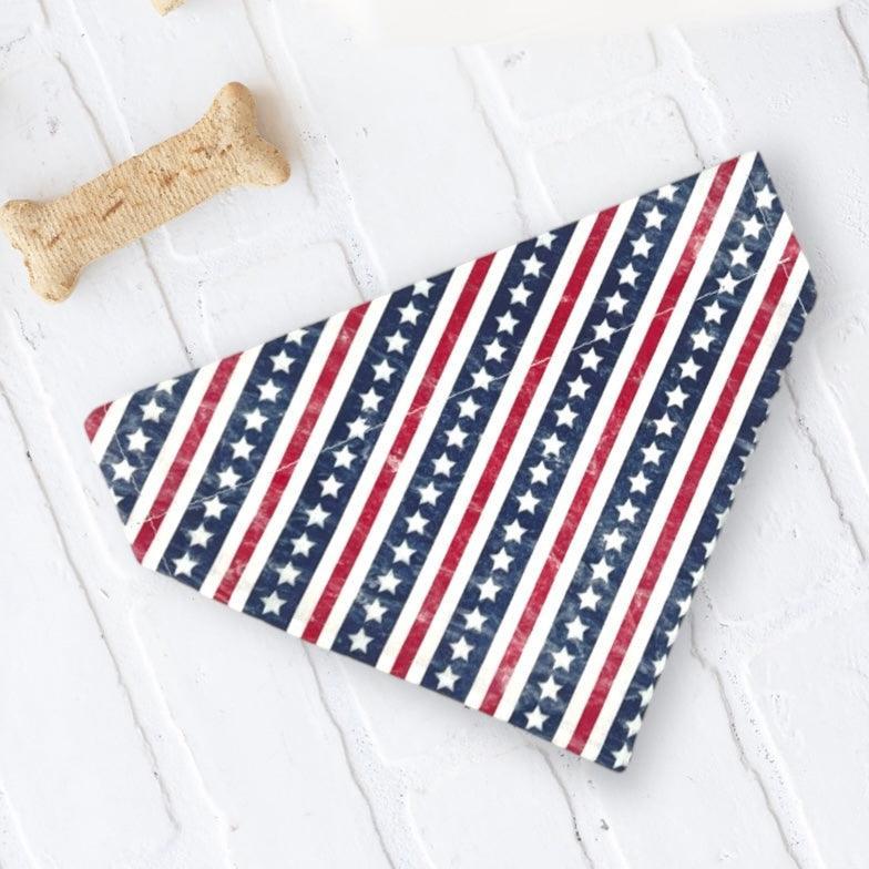 Patriotic bandana with diagonal red white stripes and white stars for dogs or cats on a white background