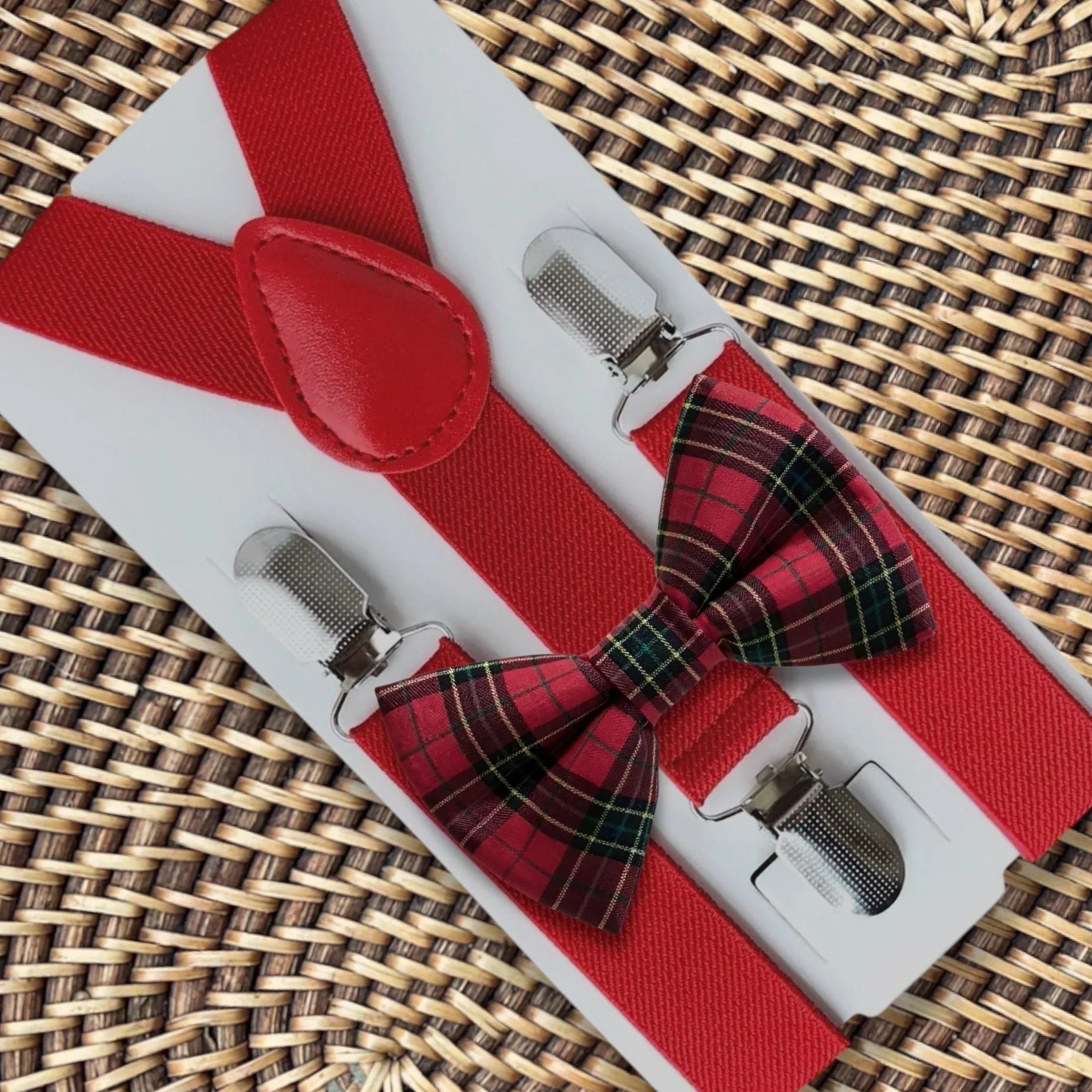 Plaid bow tie and suspenders in red.